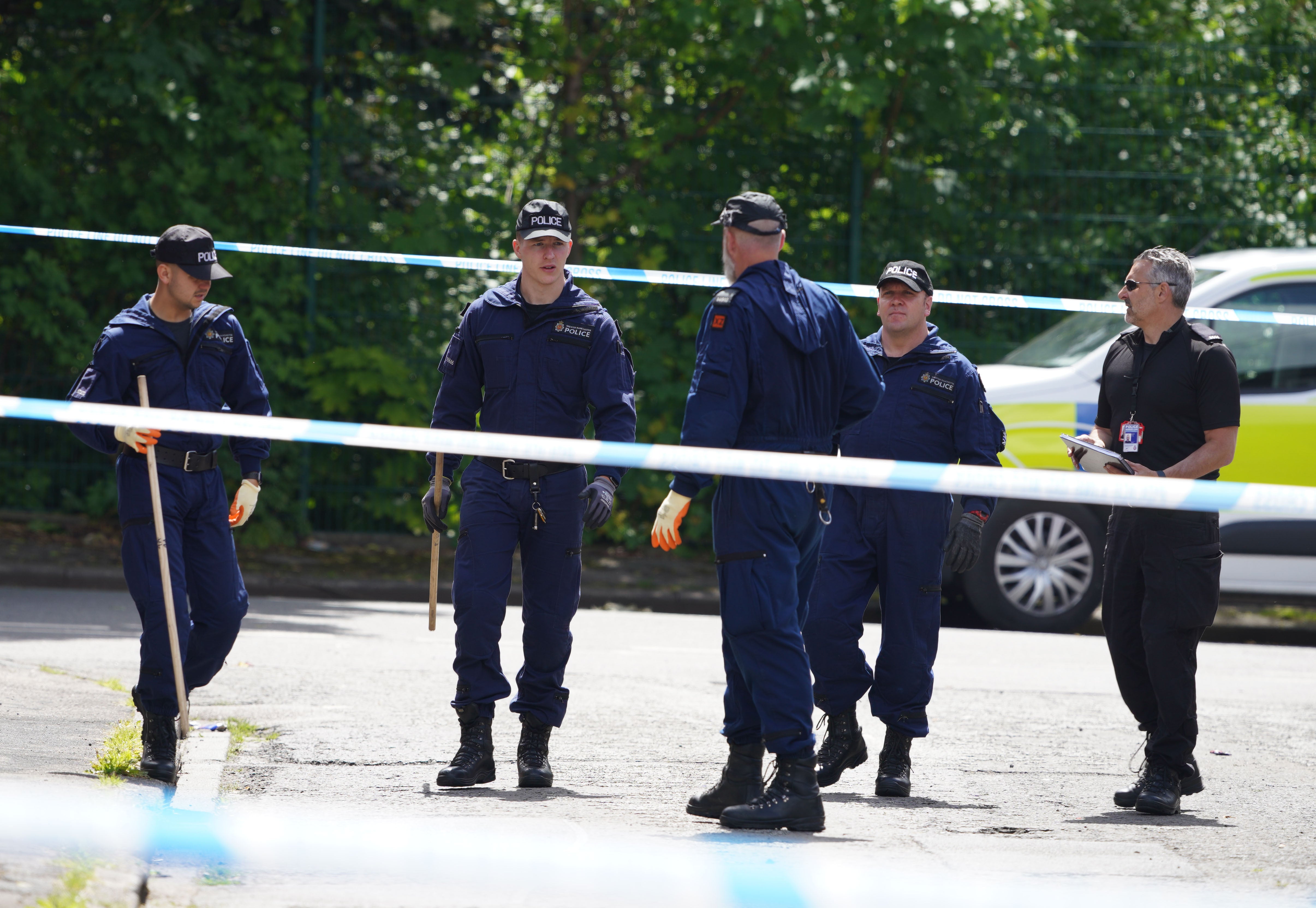 Police at the scene of the stabbing in Bednal Avenue, Miles Platting