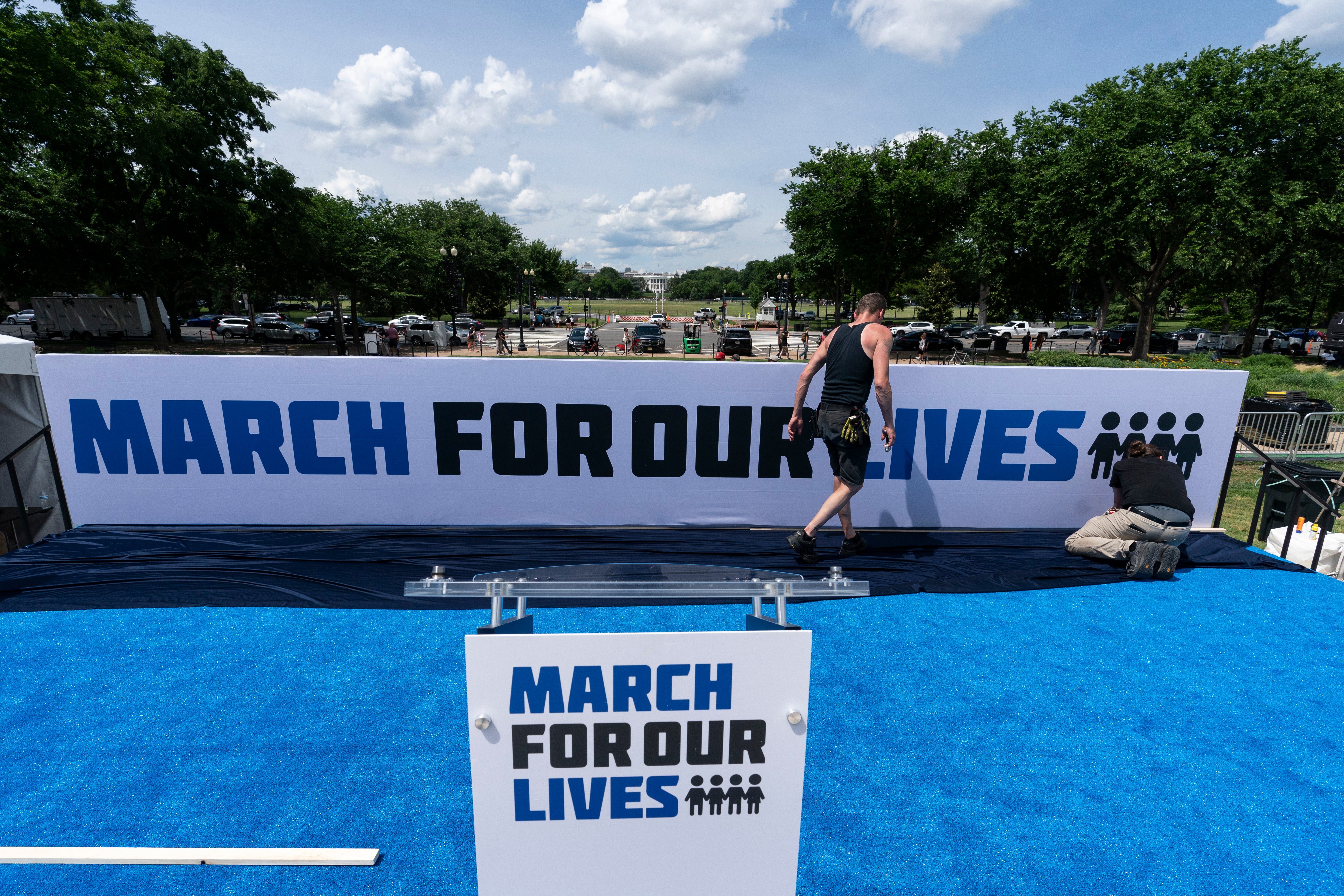 Workers set up for the March for Our Lives rally on the National Mall on Friday