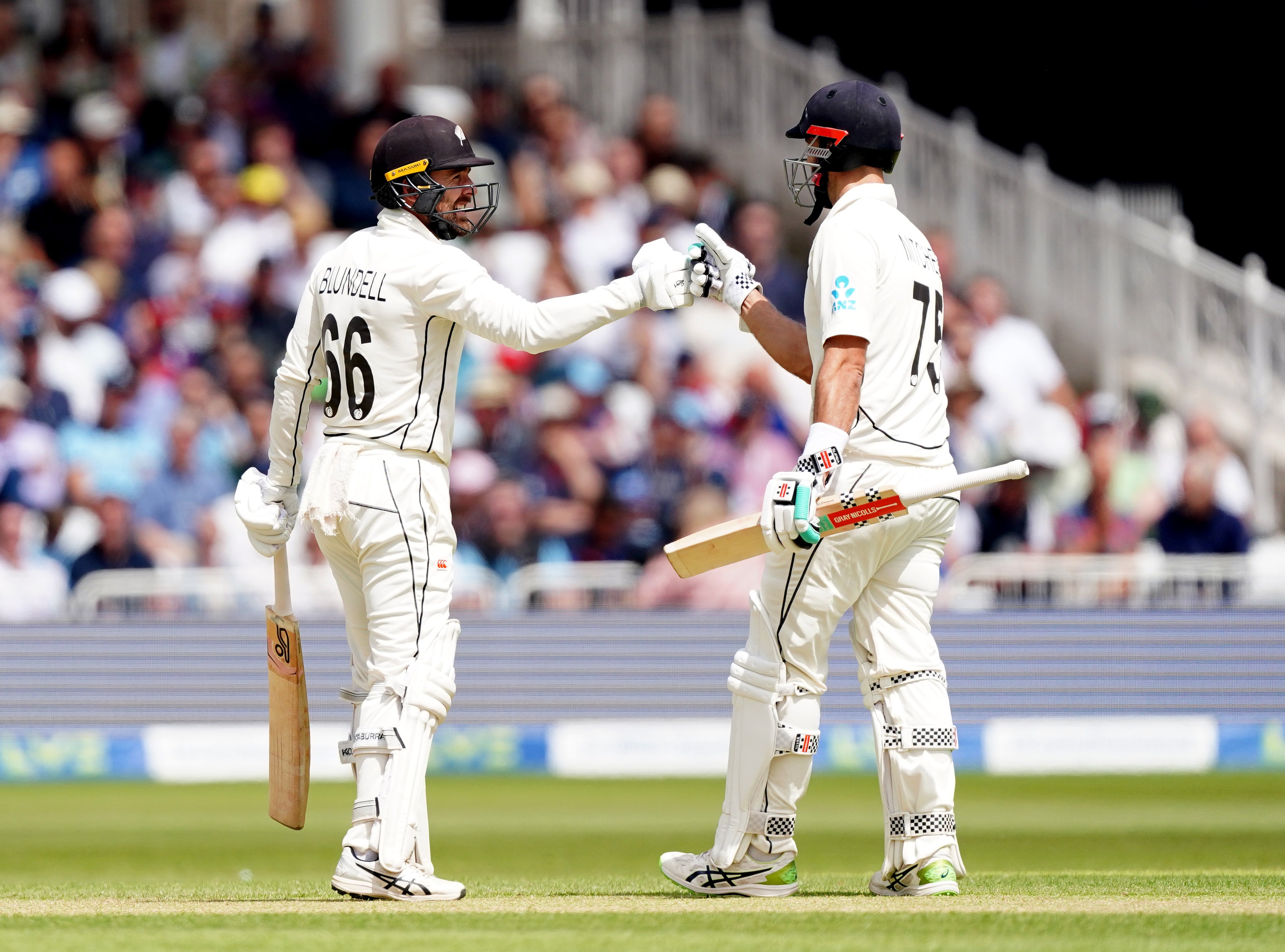 New Zealand’s Tom Blundell (left) celebrates with Daryl Mitchell after completing his century at Trent Bridge (Mike Egerton/PA Images).