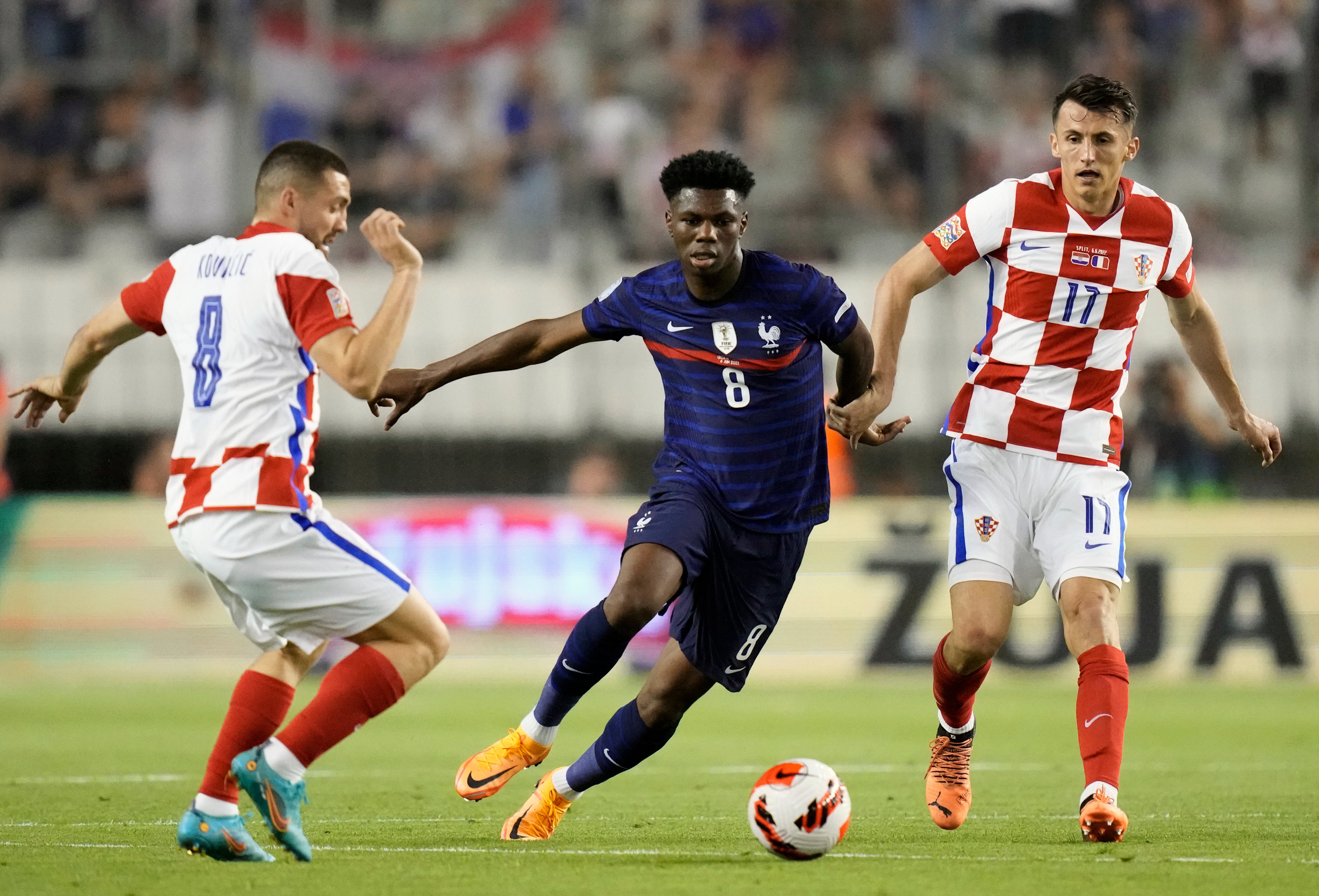 Aurelien Tchouameni, centre, has signed a six-year deal with Real Madrid (Darko Bandic/AP)