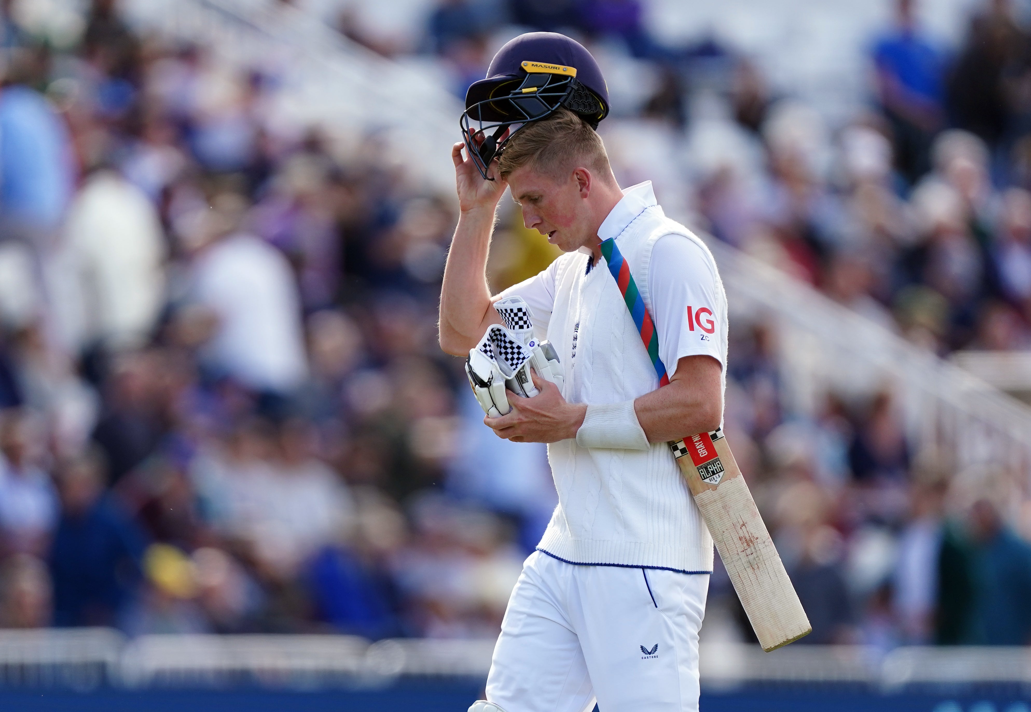 Zak Crawley leaves the field after being bowled by Trent Boult