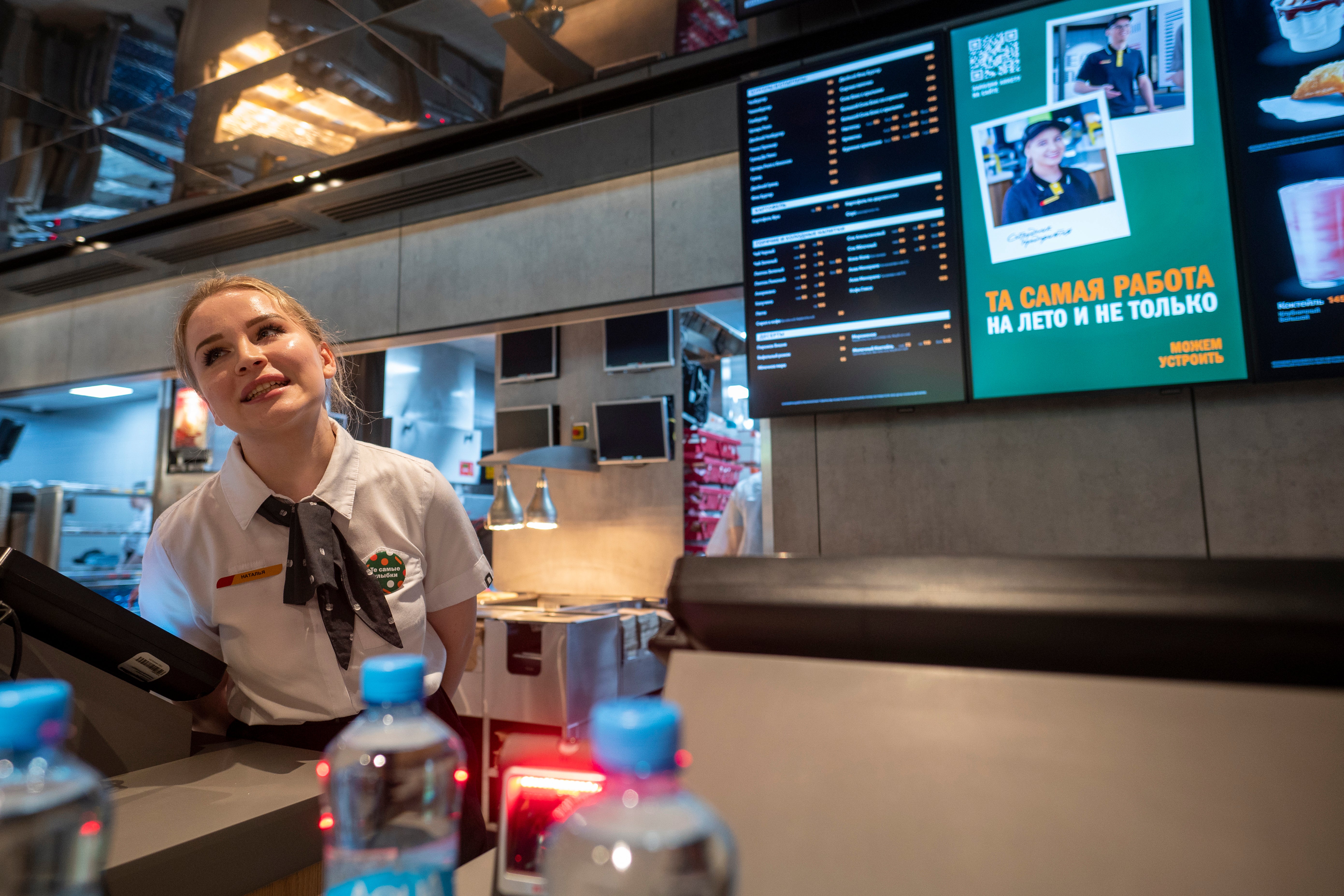 A cashier serves customers at one of the new fast-food restaurants on Bolshaya Bronnaya Street in Moscow
