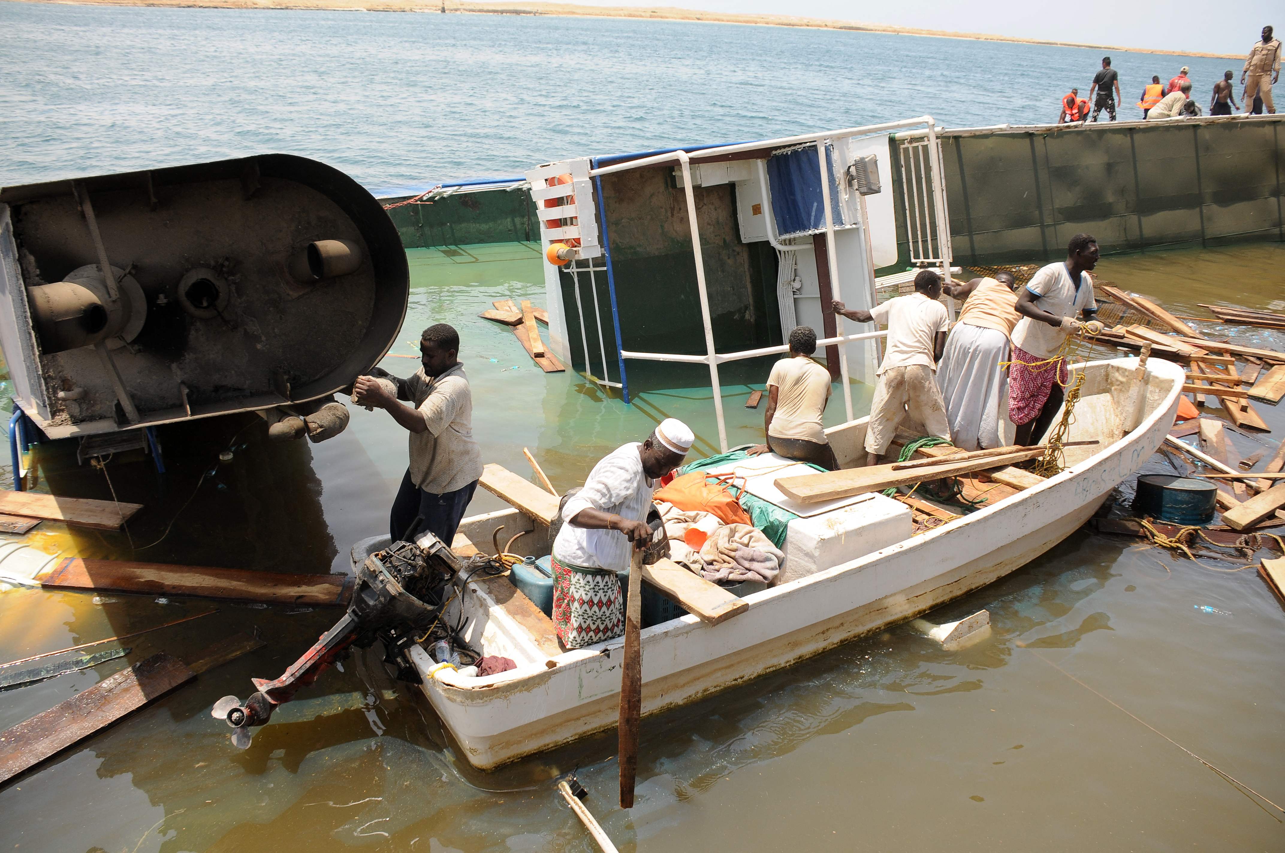 Men in a boat search for sheep