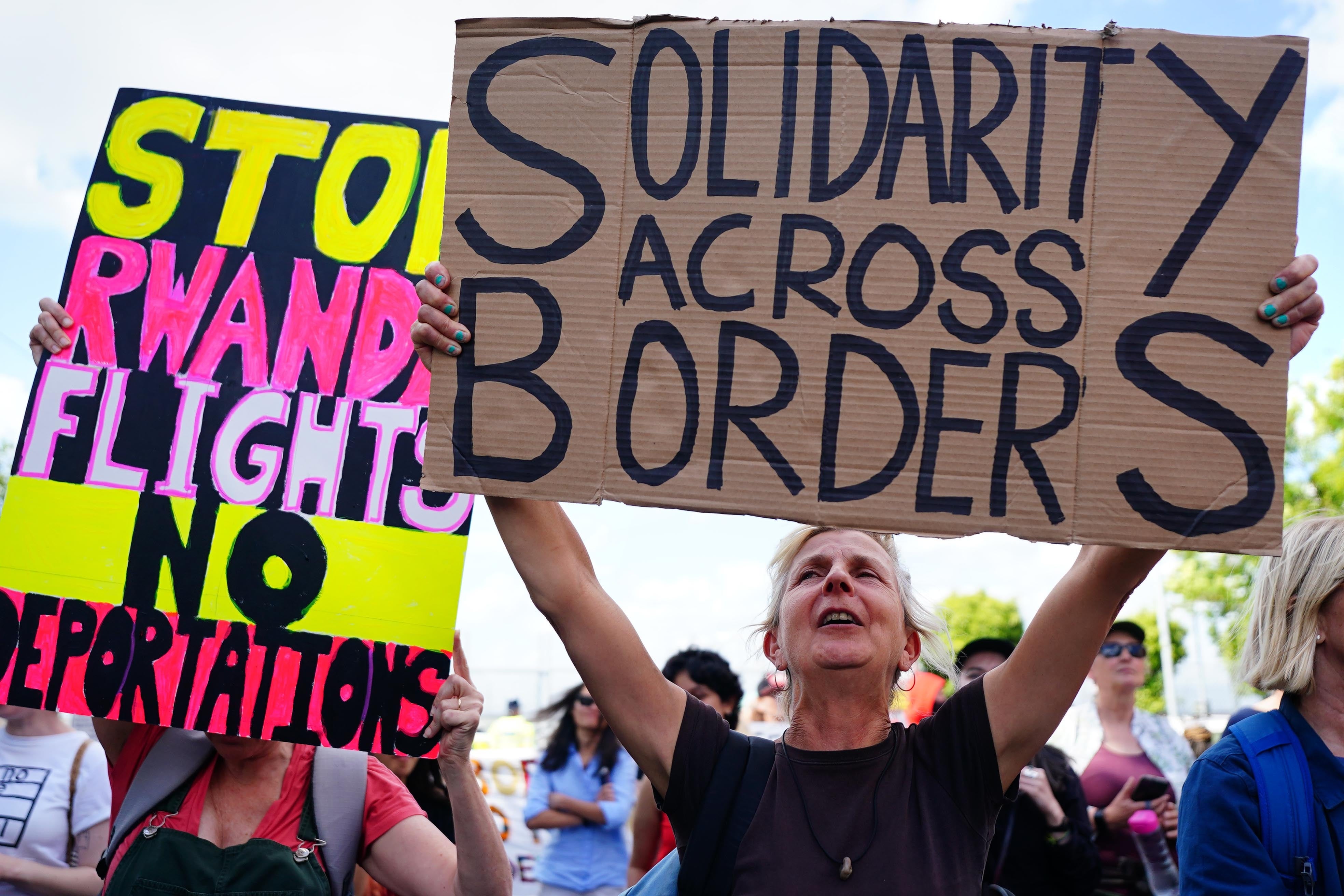 Demonstrators at a removal centre at Gatwick protest against plans to send migrants to Rwanda at the weekend (Victoria Jones/PA)