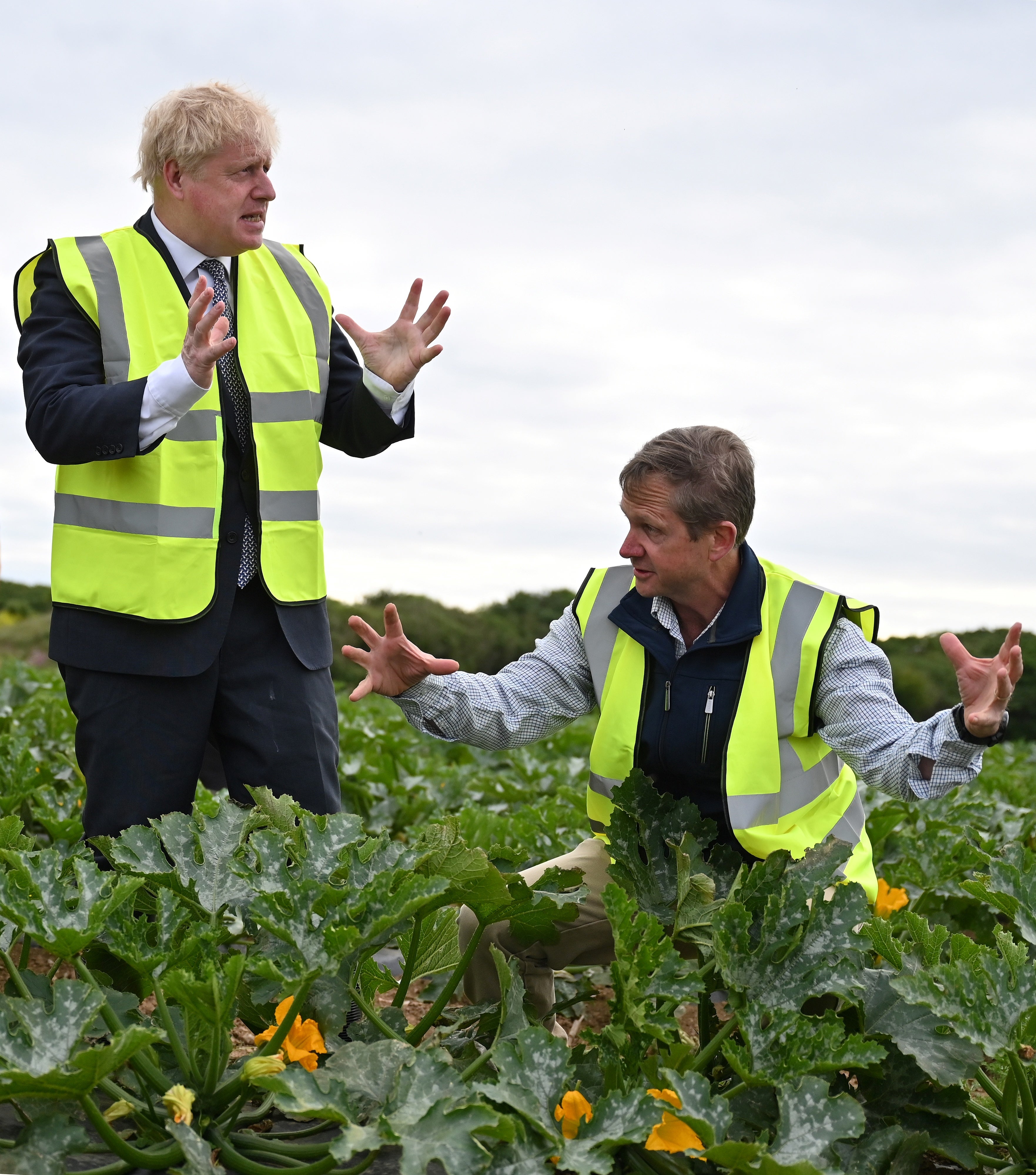 Boris Johnson talks to farm manger Gordon Stokes during a visit to Southern England Farms in Cornwall