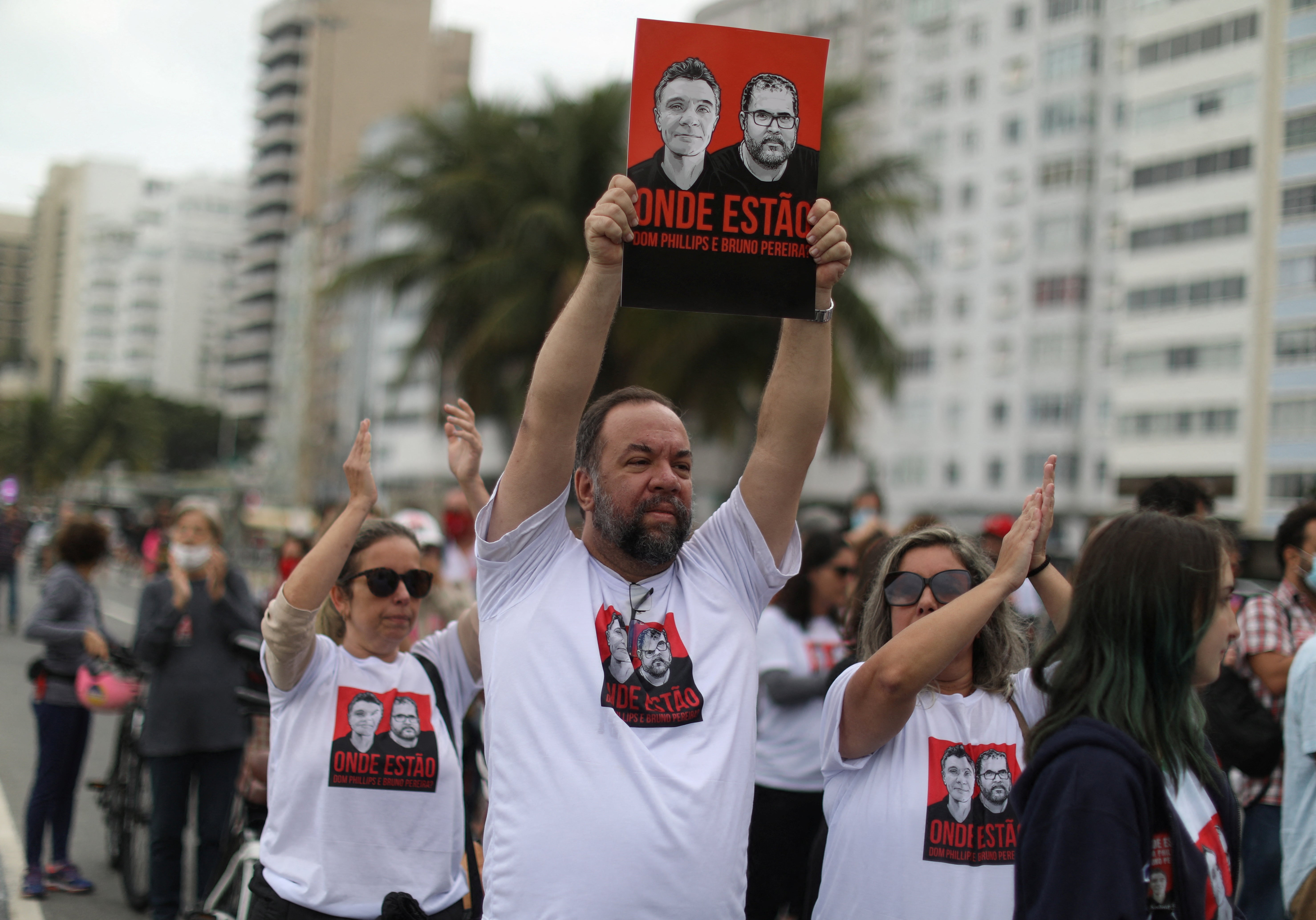 Relatives of British journalist Dom Phillips’ wife hold placards at a protest on 12 June, 2022