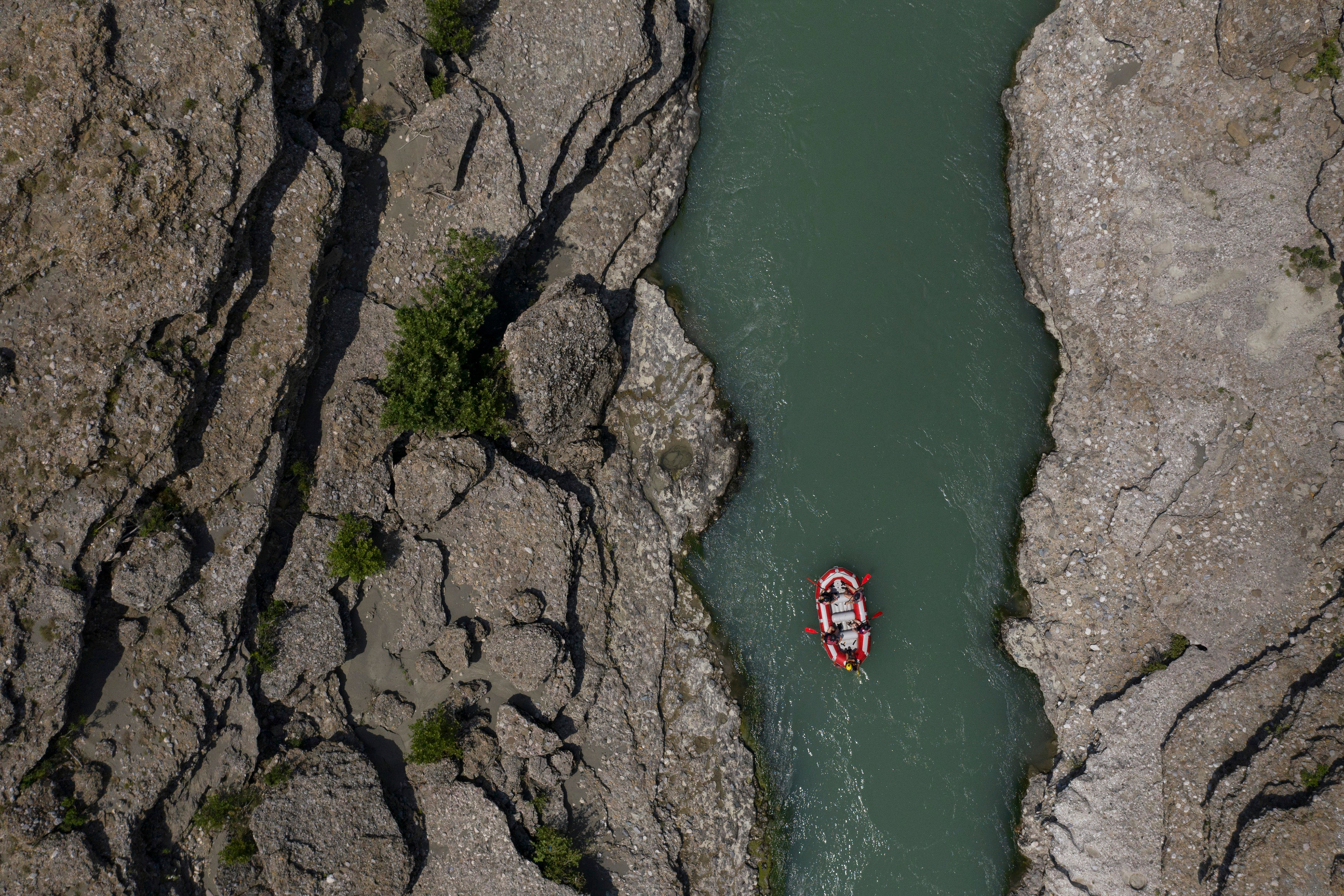 People raft on the Vjosa River near Permet, Albania, June 25, 2019