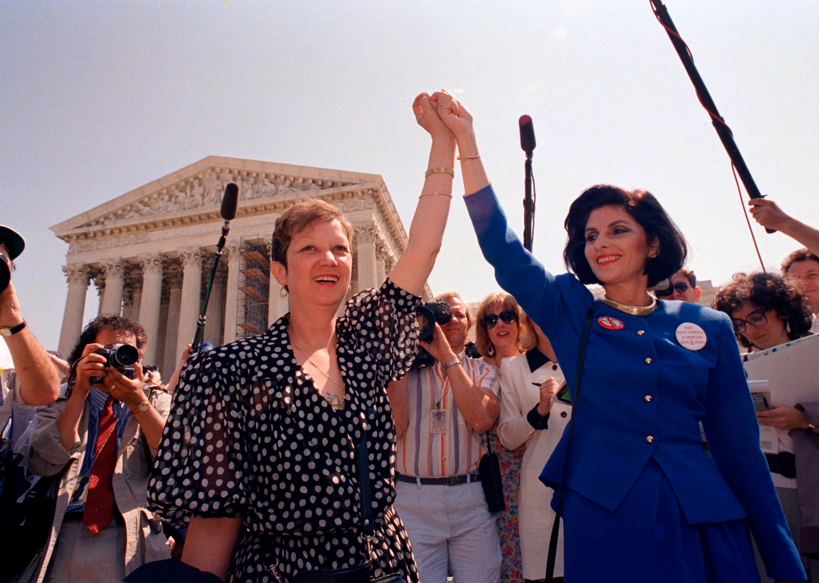 Norma McCorvey (left) outside the Supreme Court