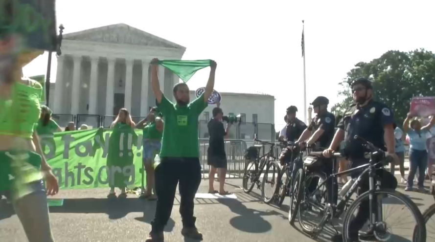 Abortion rights advocates blockaded intersections in front of the Supreme Court on Monday to voice their support for Roe v Wade