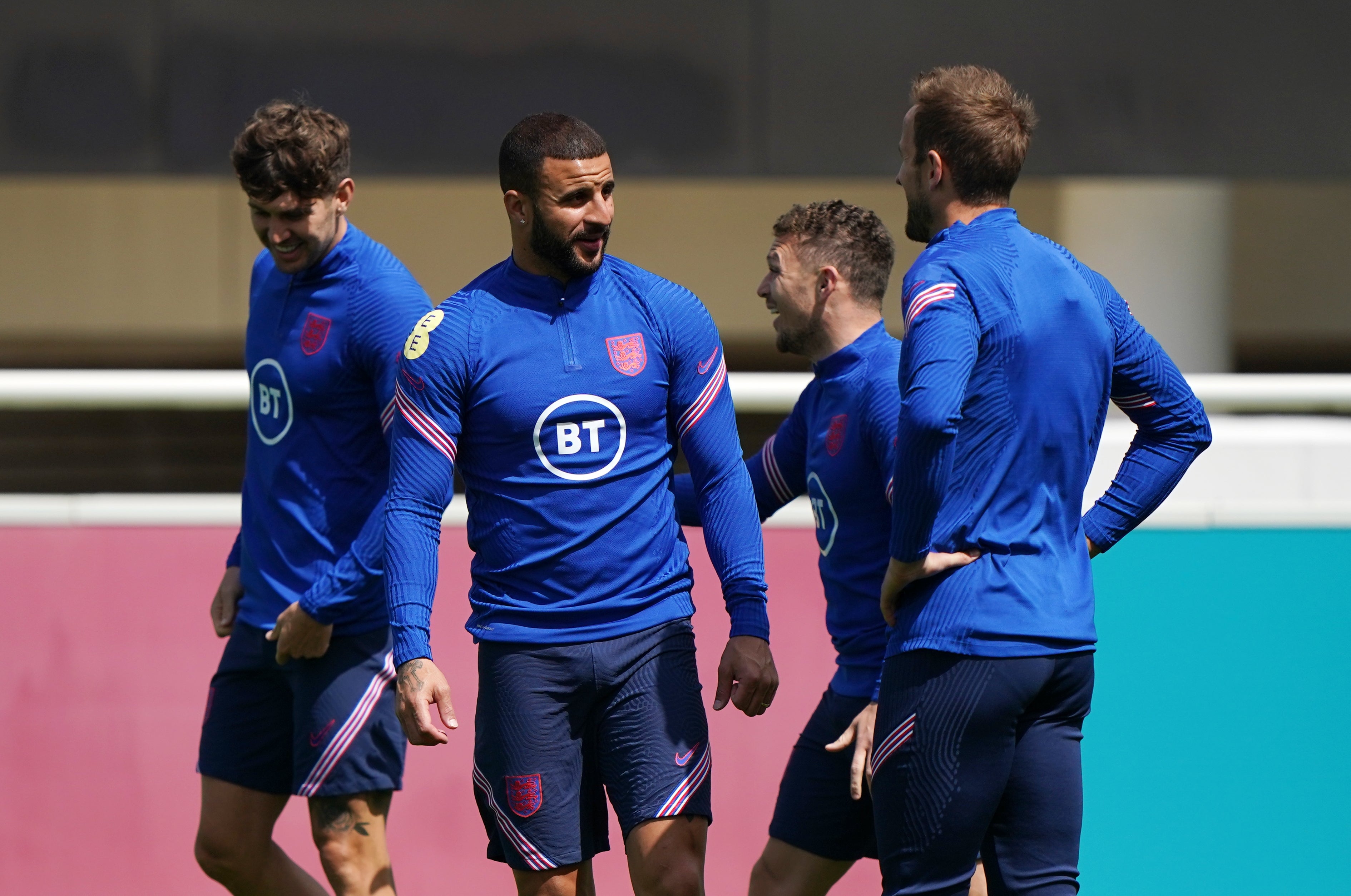 Kyle Walker speaks to Harry Kane during a training session at St George’s Park (Joe Giddens/PA)