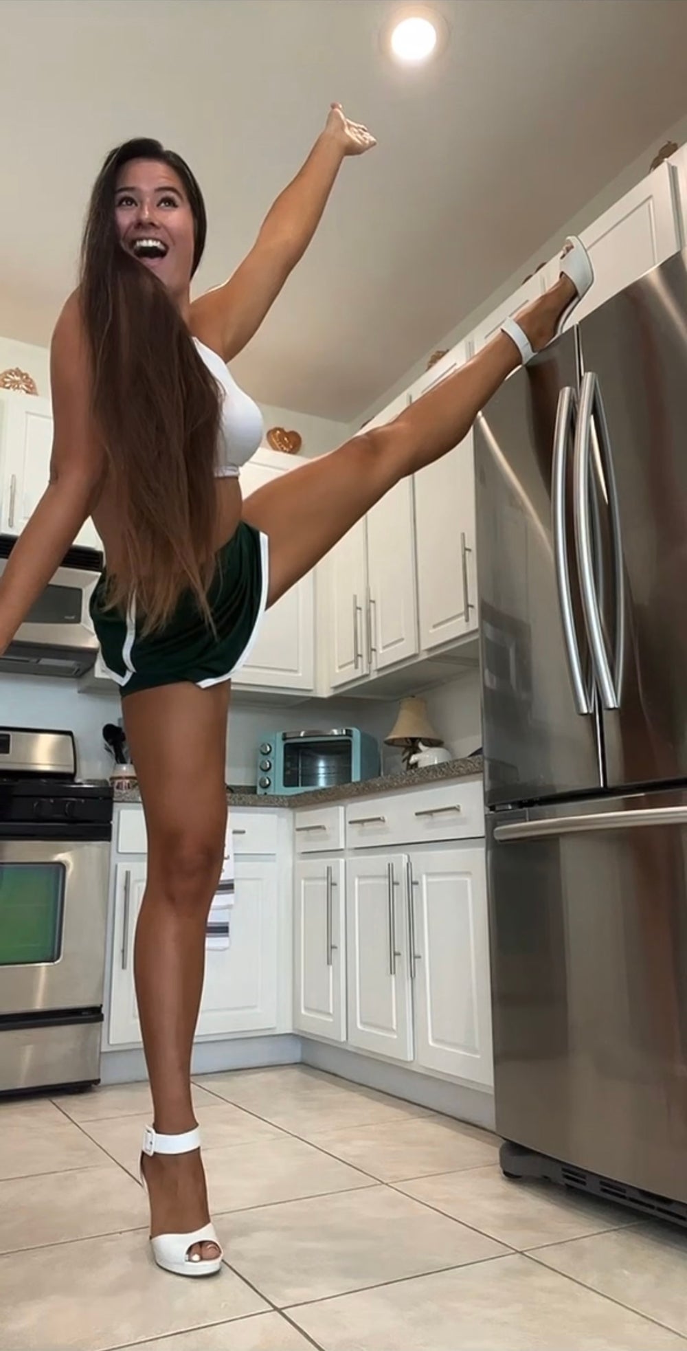 Marie Temara, 27, likes to kick her leg on top of her 5ft10 fridge (Collect/PA Images)