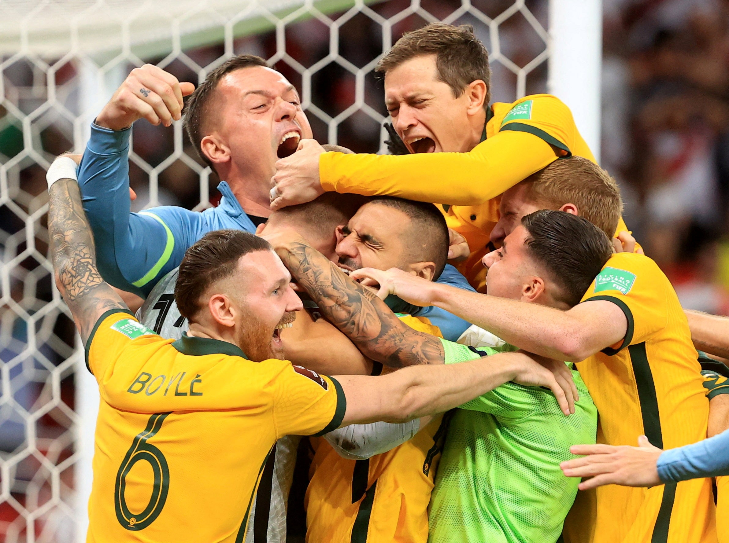 Australia celebrate with goalkeeper Andrew Redmayne