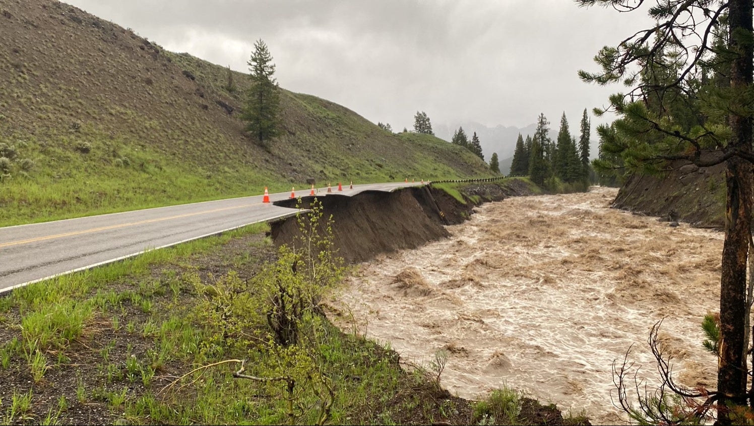 High water levels in the Lamar River erode Yellowstone National Park's Northeast Entrance Road, where the park was closed due to heavy flooding, rockslides, extremely hazardous conditions near Gardiner, Montana, U.S. June 13, 2022