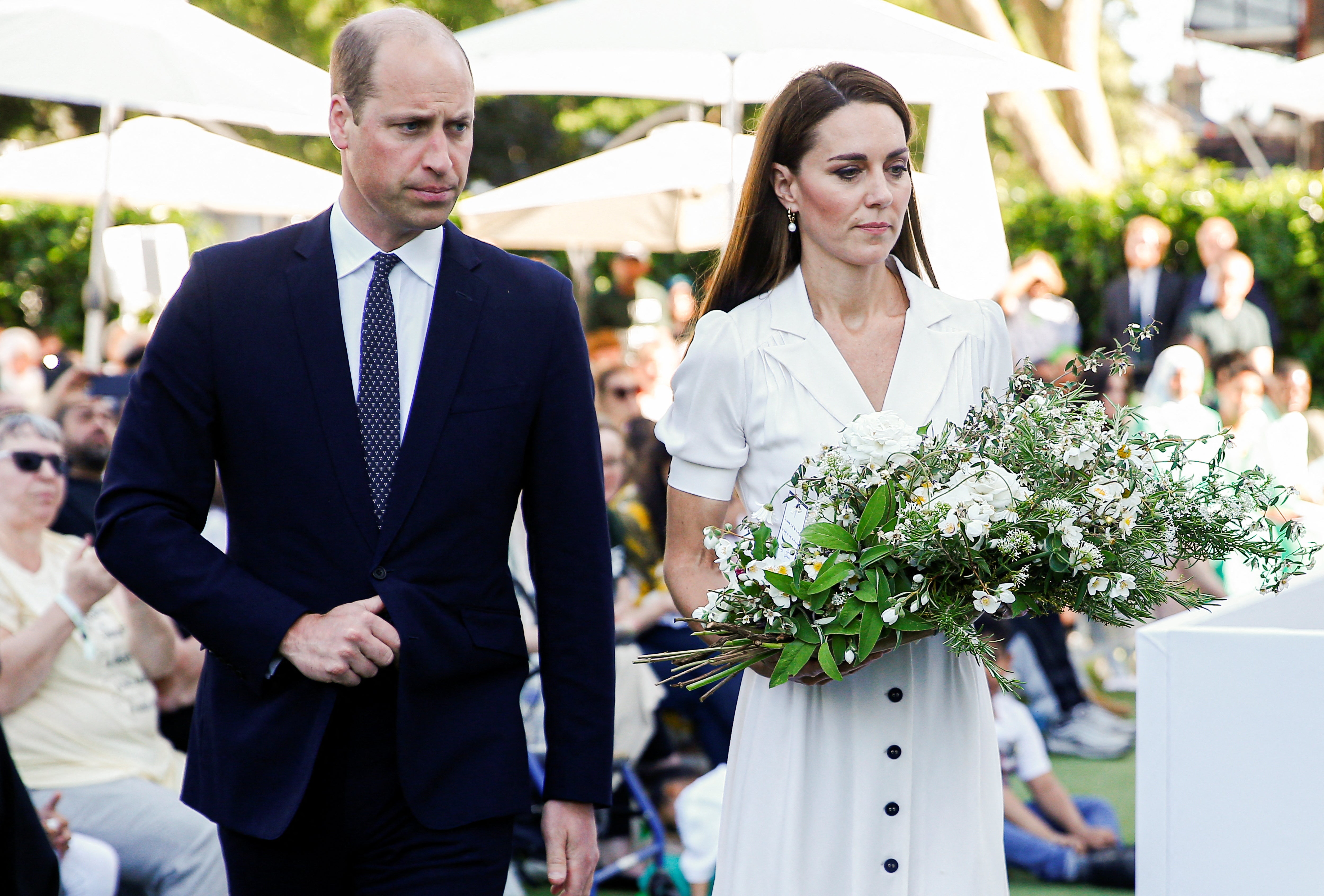 The Duke and Duchess of Cambridge lay a wreath during a ceremony at the base of Grenfell Tower (Peter Nicholls/PA)