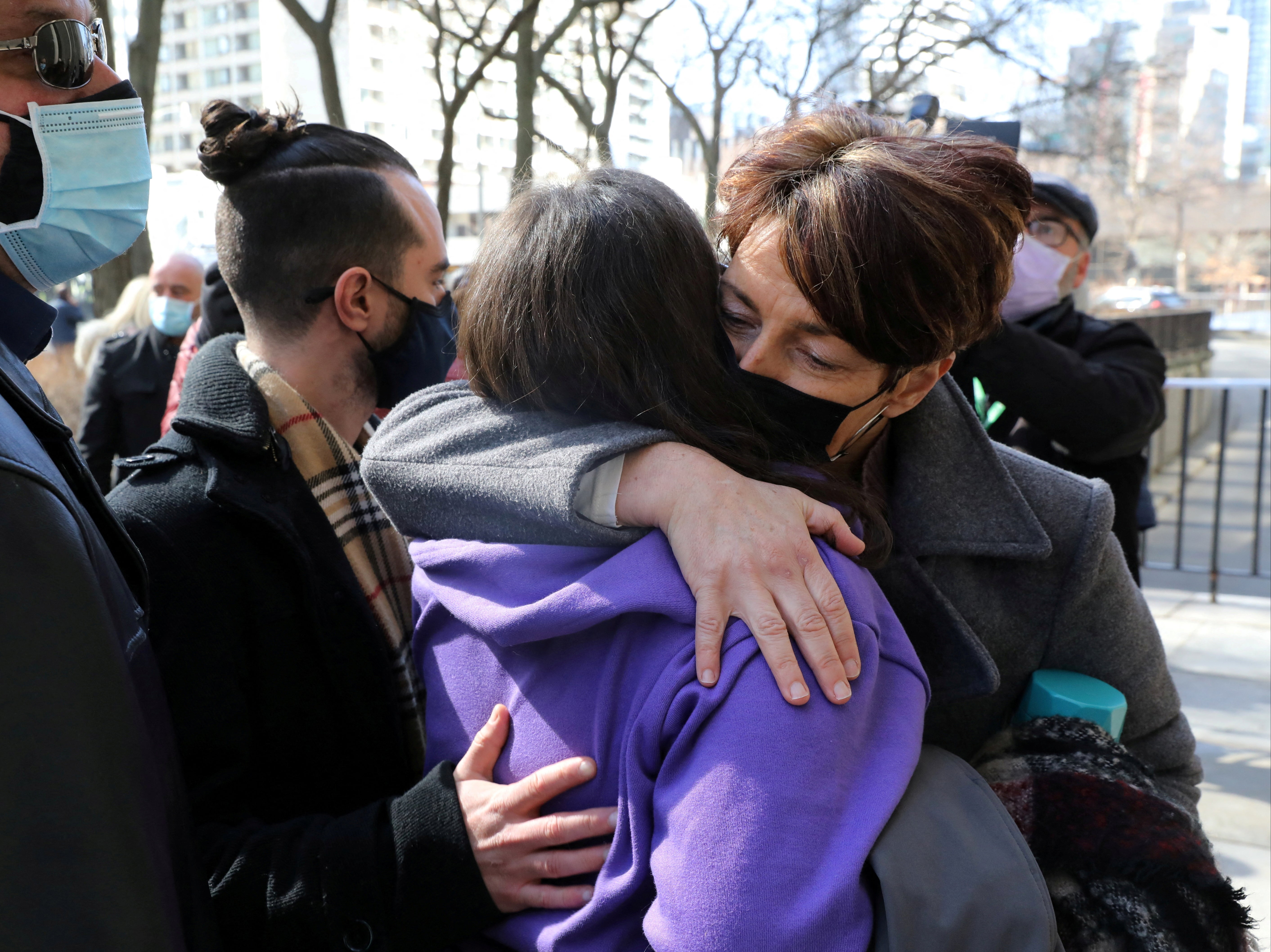 Families of the victims of a deadly 2018 van attack react after the guilty verdict in March 2021