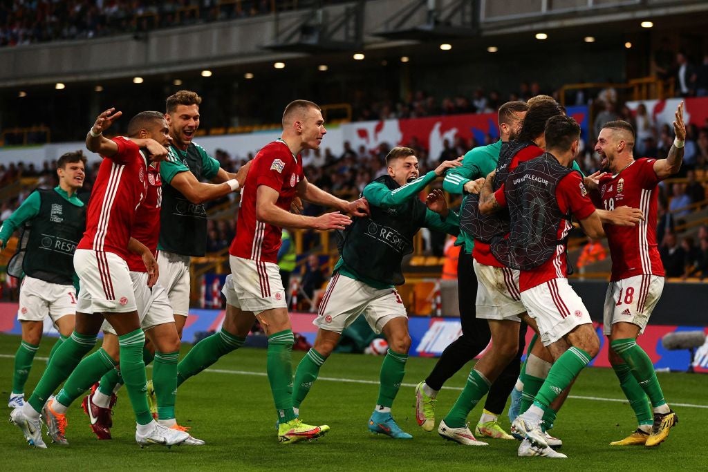 Hungary's defender Zsolt Nagy, right, celebrates with teammates after scoring their third goal