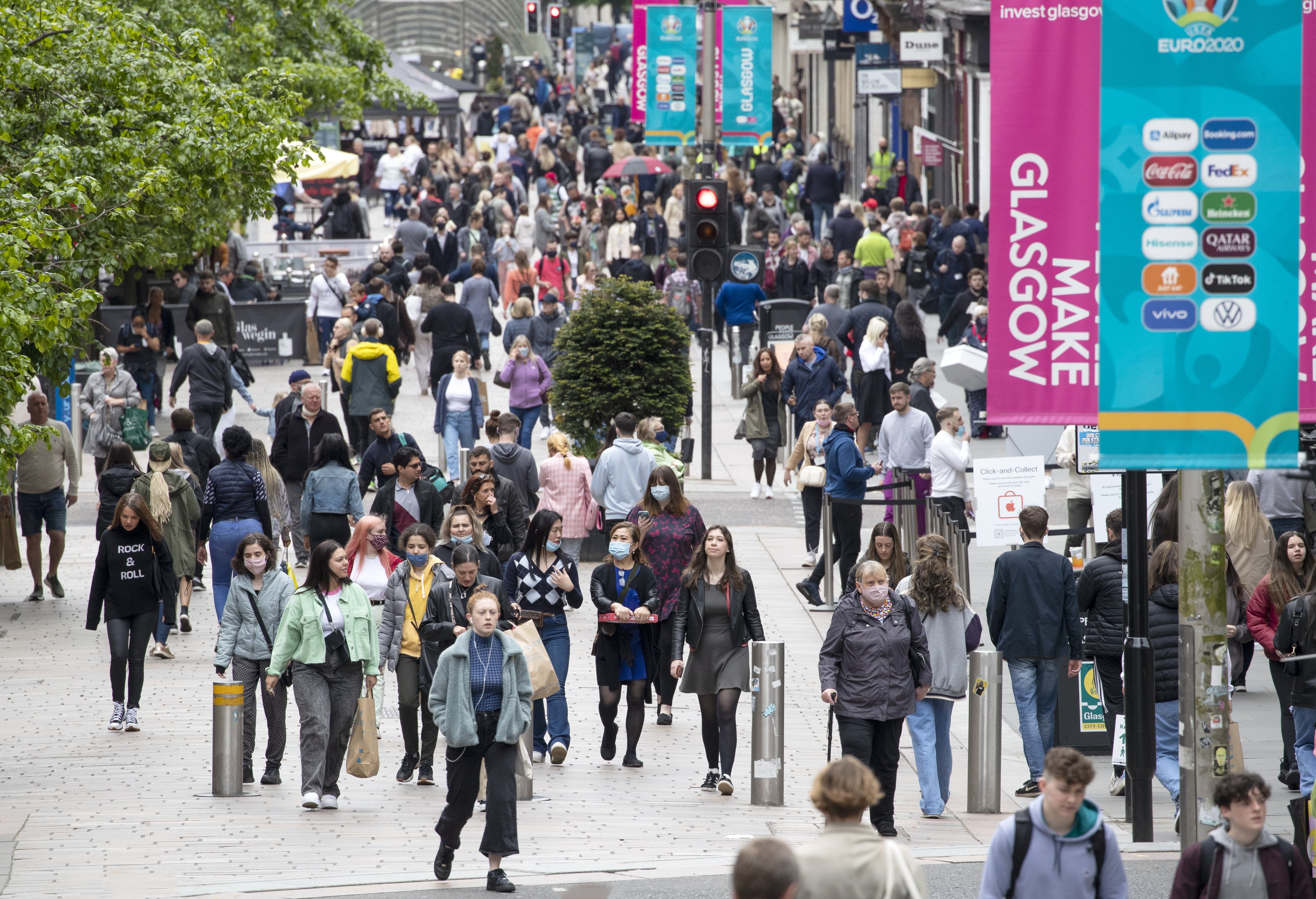 Shoppers in Glasgow city centre (PA)