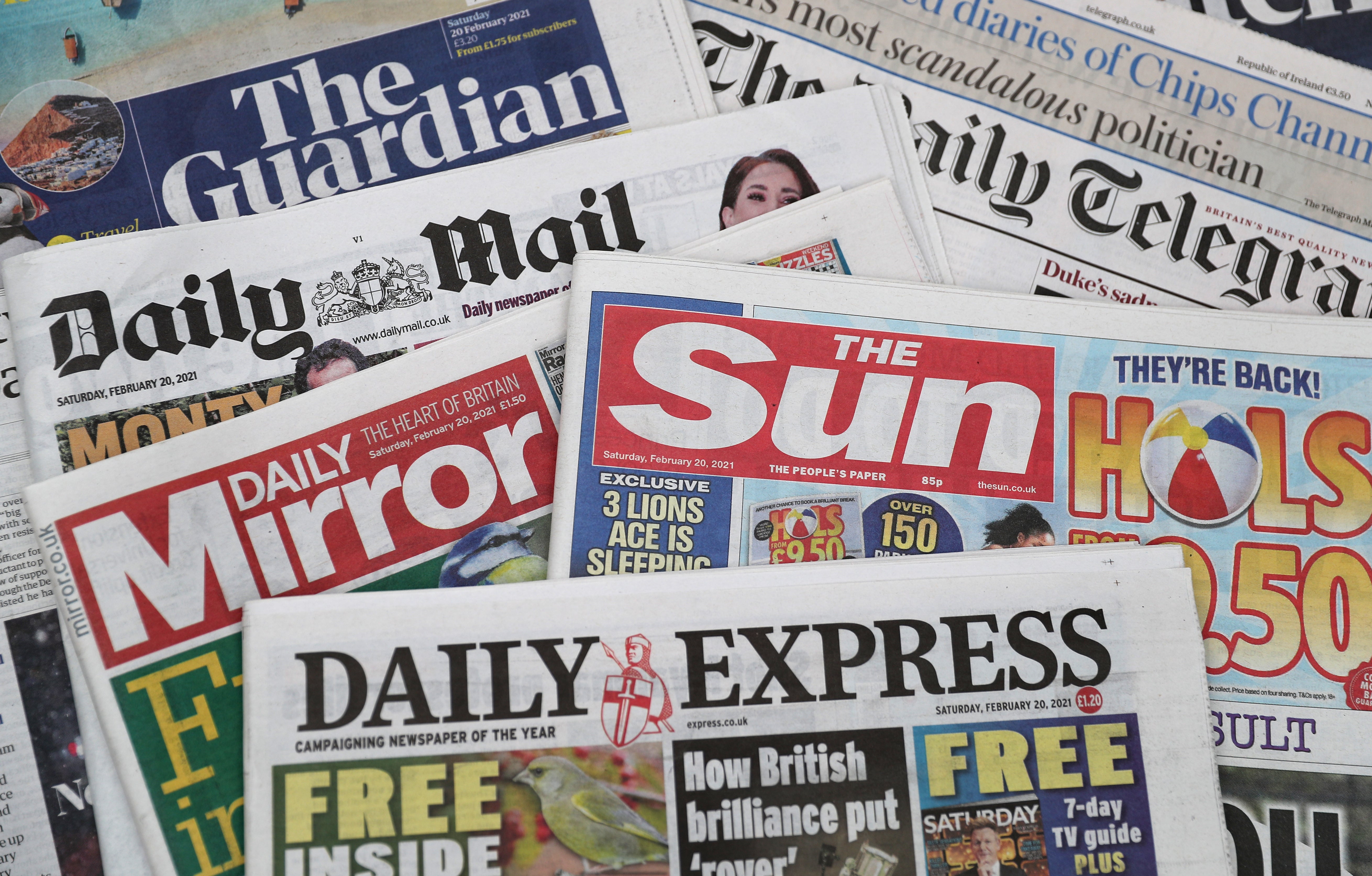 A stock image of a pile of newspapers including The Daily Telegraph, The Guardian, Daily Mirror, Daily Mail, Daily Express and The Sun. (Andrew Matthews/PA)