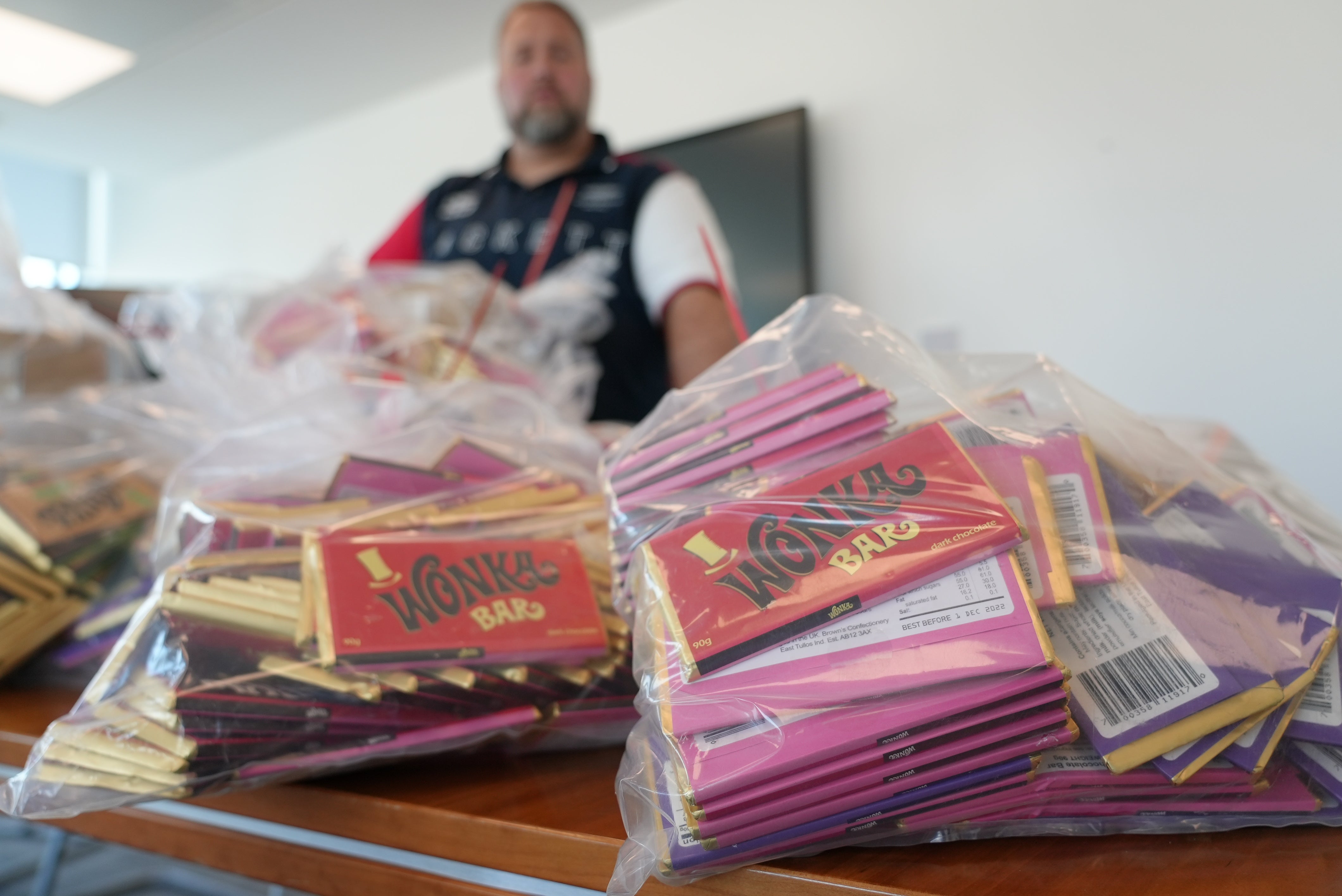 Westminster City Council Loren Phillips with items seized during a raid of three unnamed stores on London’s Oxford Street (Westminster City Council/PA)