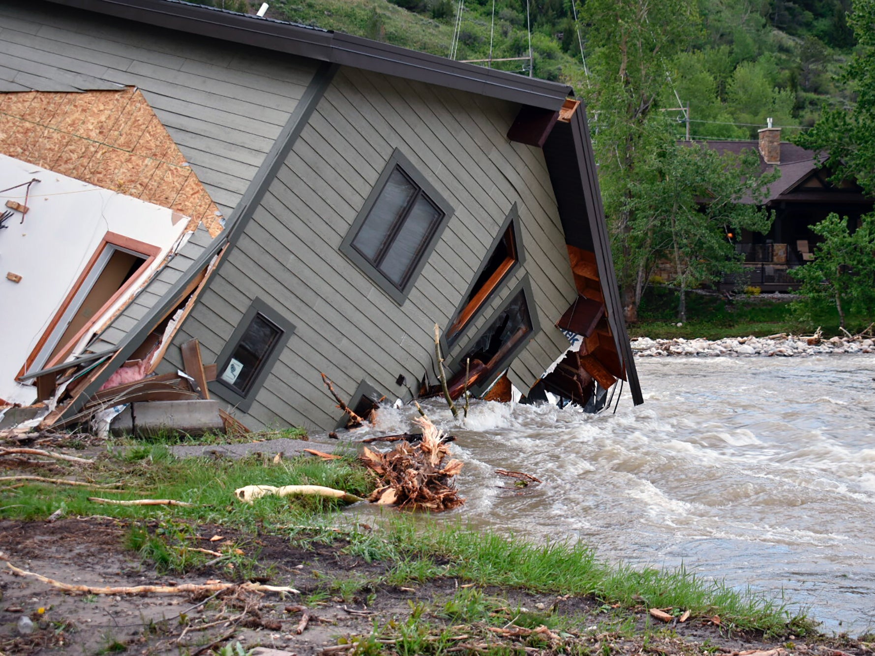 A home pulled into the water in Red Lodge, Montana