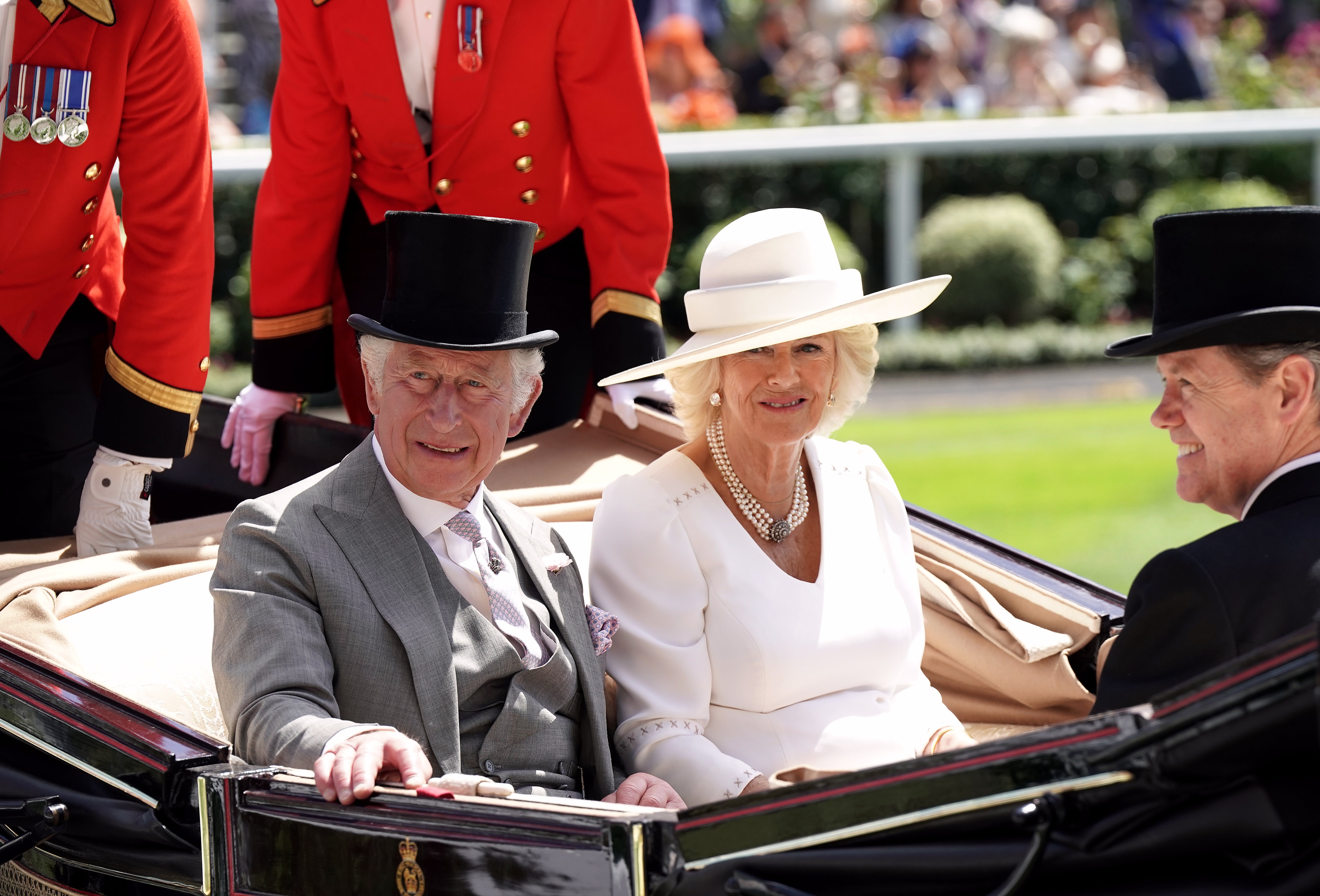 The Prince of Wales and the Duchess of Cornwall in the royal procession (PA)