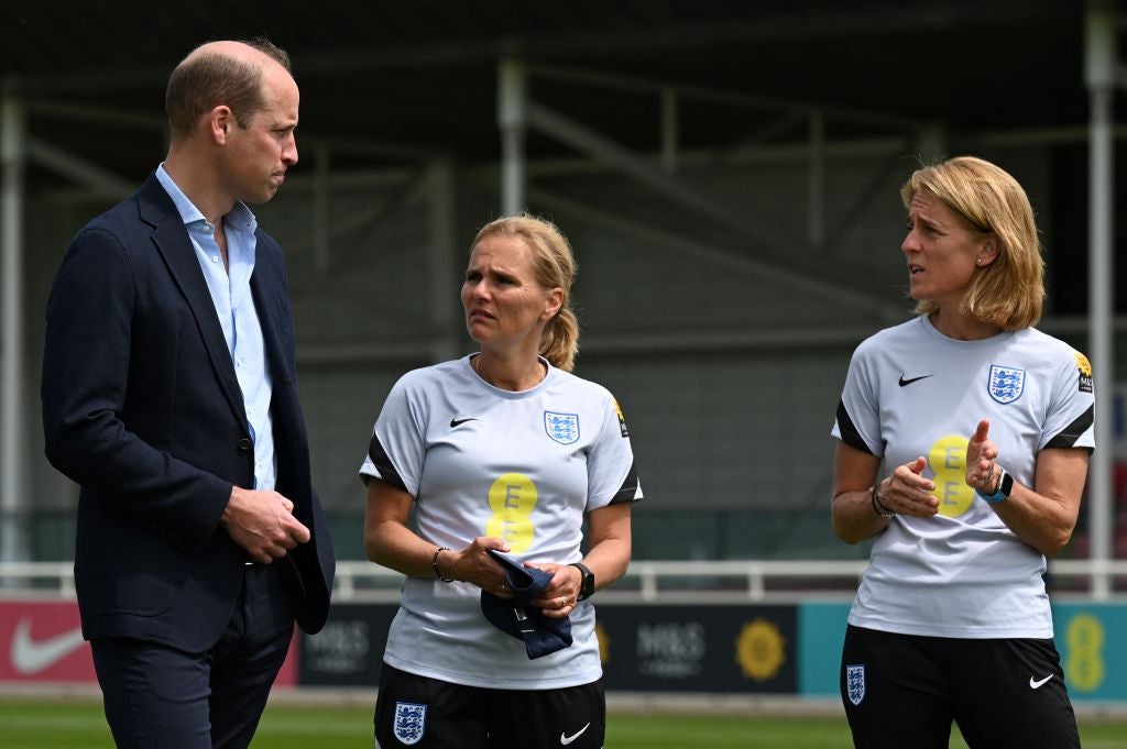 Prince William speaks with Wiegman and her assistant Anja Van Ginhoven at St George's Park