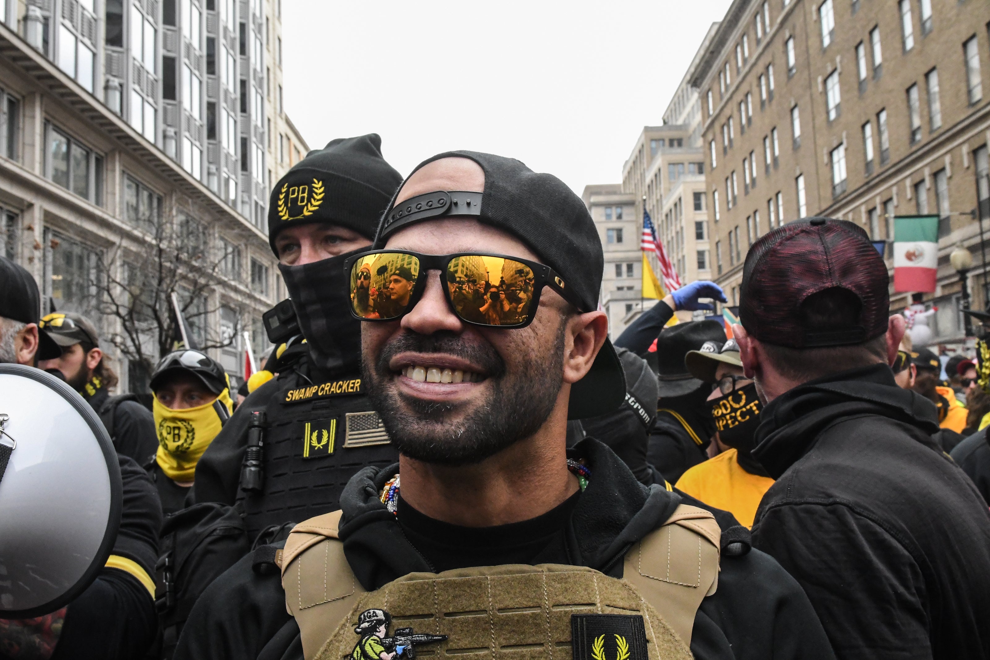 Enrique Tarrio, former leader of the Proud Boys, stands outside Harry's bar during a protest on December 12, 2020 in Washington, DC, wearing Oakley sunglasses