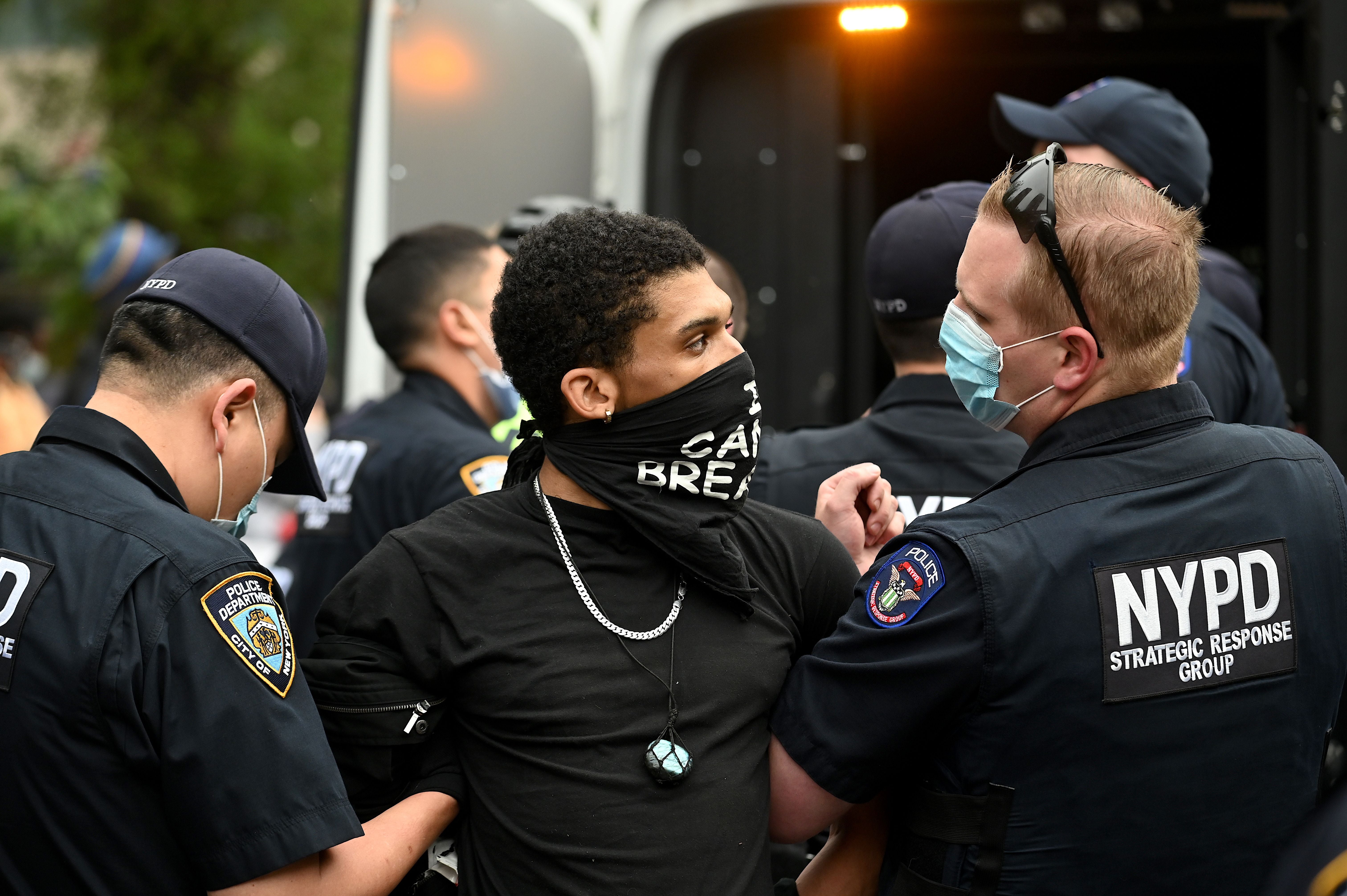 A New York City police officer wearing Oakleys arrests a Black Lives Matter protester in 2020 during the George Floyd protests