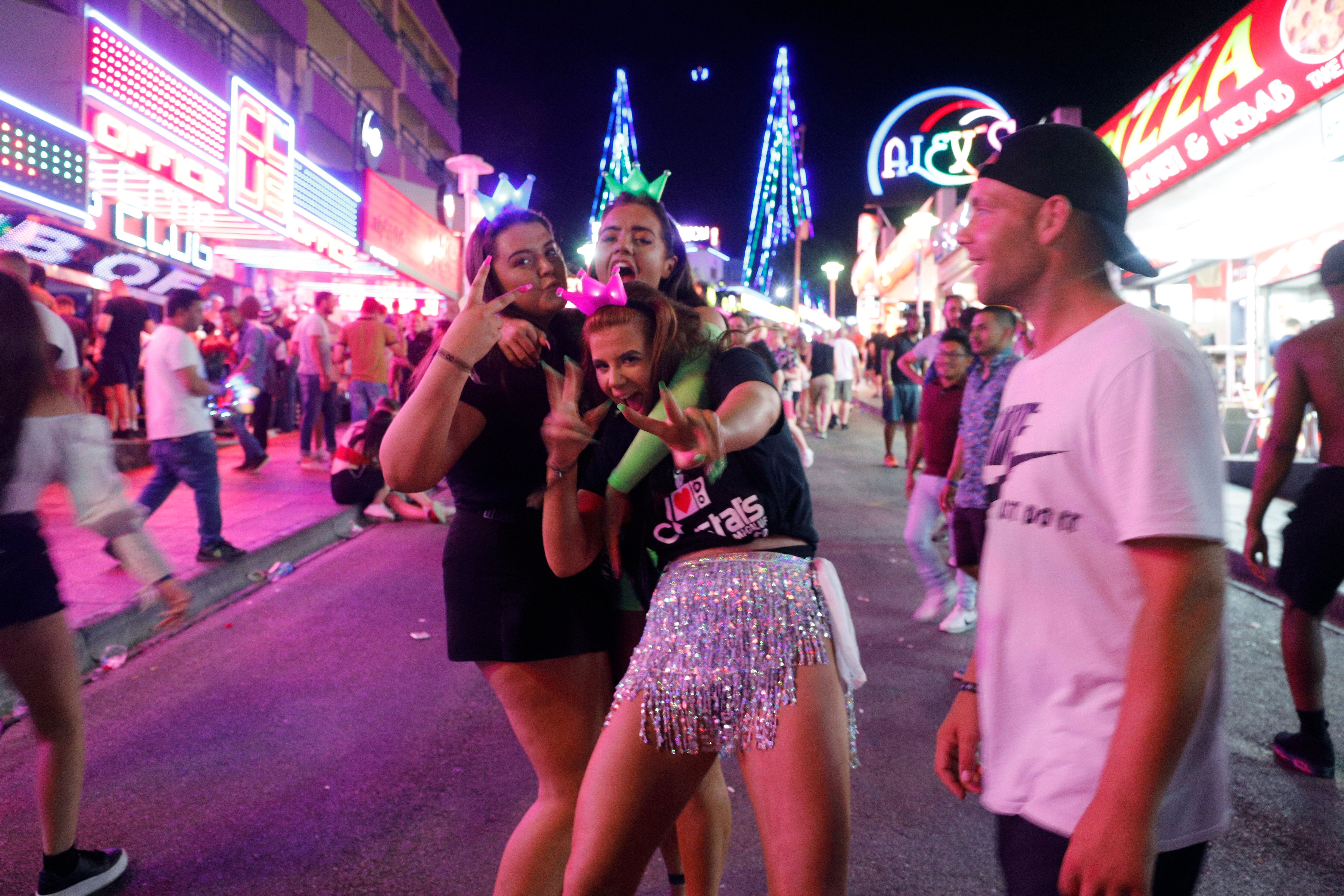 Tourists visit the popular Punta Ballena strip on June 30, 2019 in Magaluf, Spain