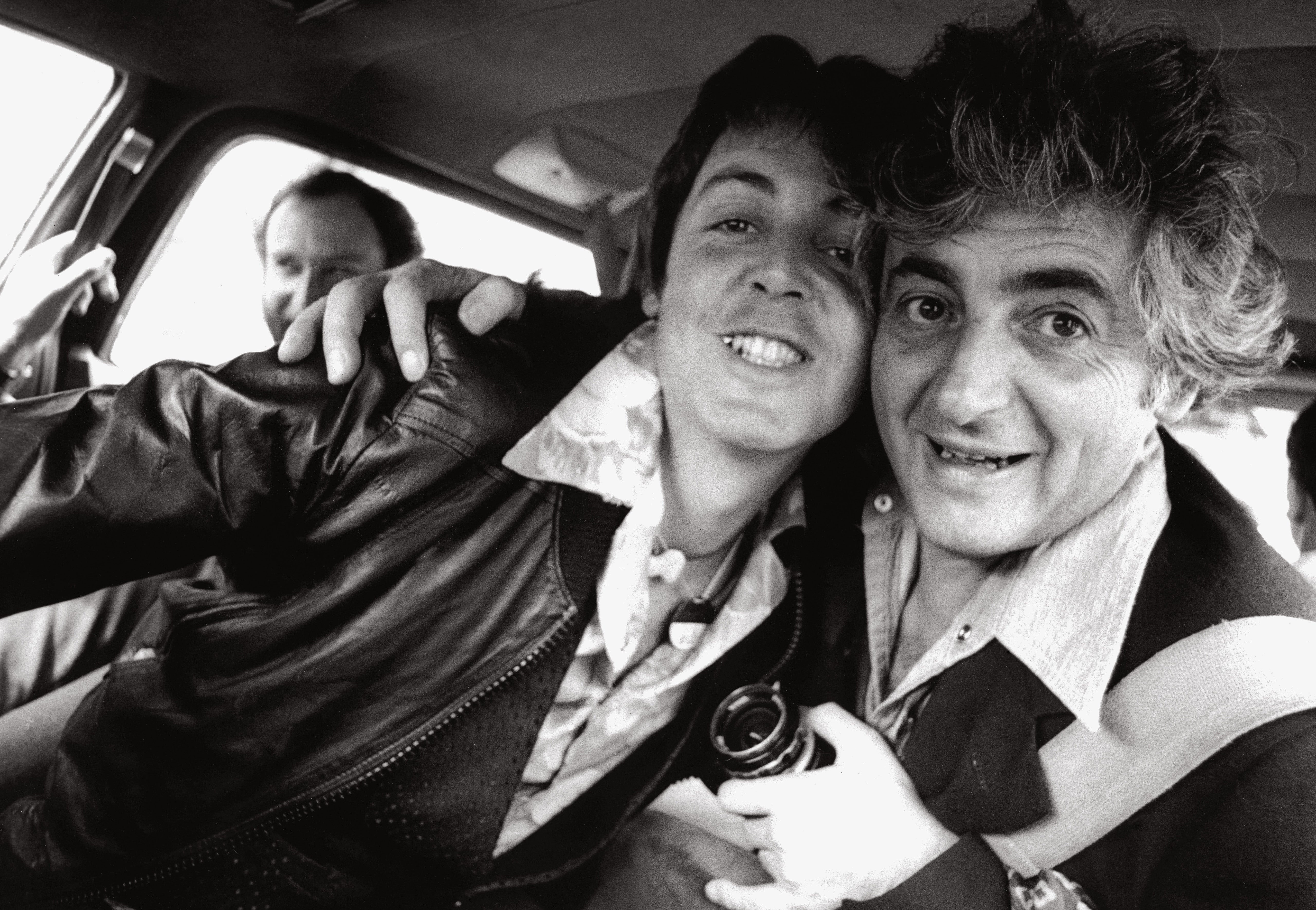 Linda took Harry’s camera to photograph Paul and him in their limo on the way to the Wings Over America plane, Los Angeles, 1976