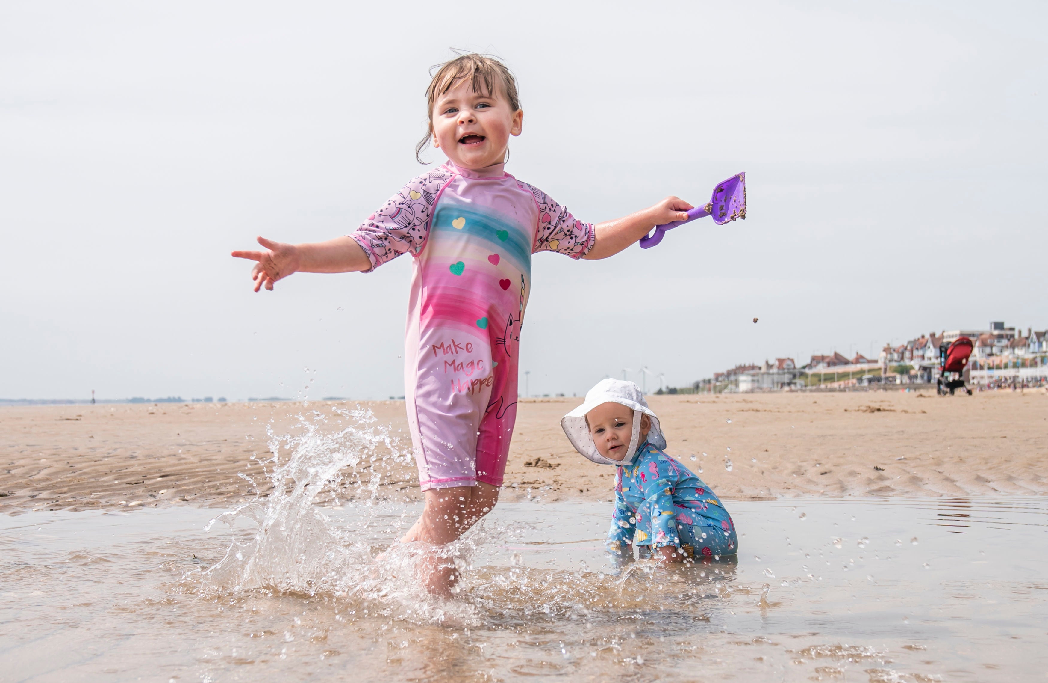 Esmae Crawforth, left, and Ione Crawforth enjoy the hot weather on Bridlington beach on Thursday