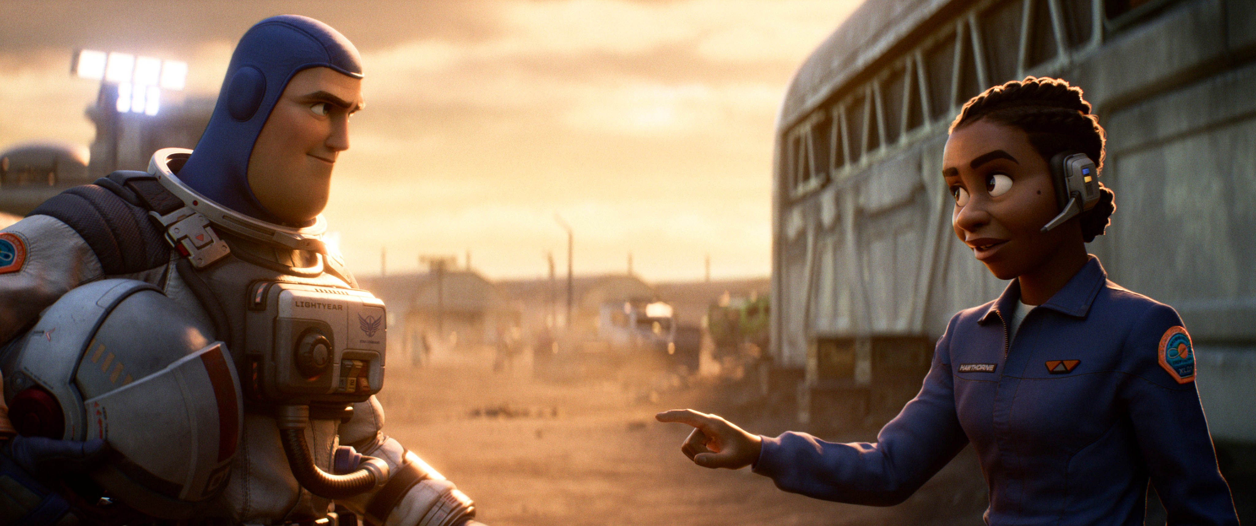 Buzz Lightyear, voiced by Chris Evans, and Alisha Hawthorne, voiced by Uzo Aduba, in a scene from Lightyear; Snoop Dogg says seeing a same-sex couple the film left him ‘scared to go to the movies’