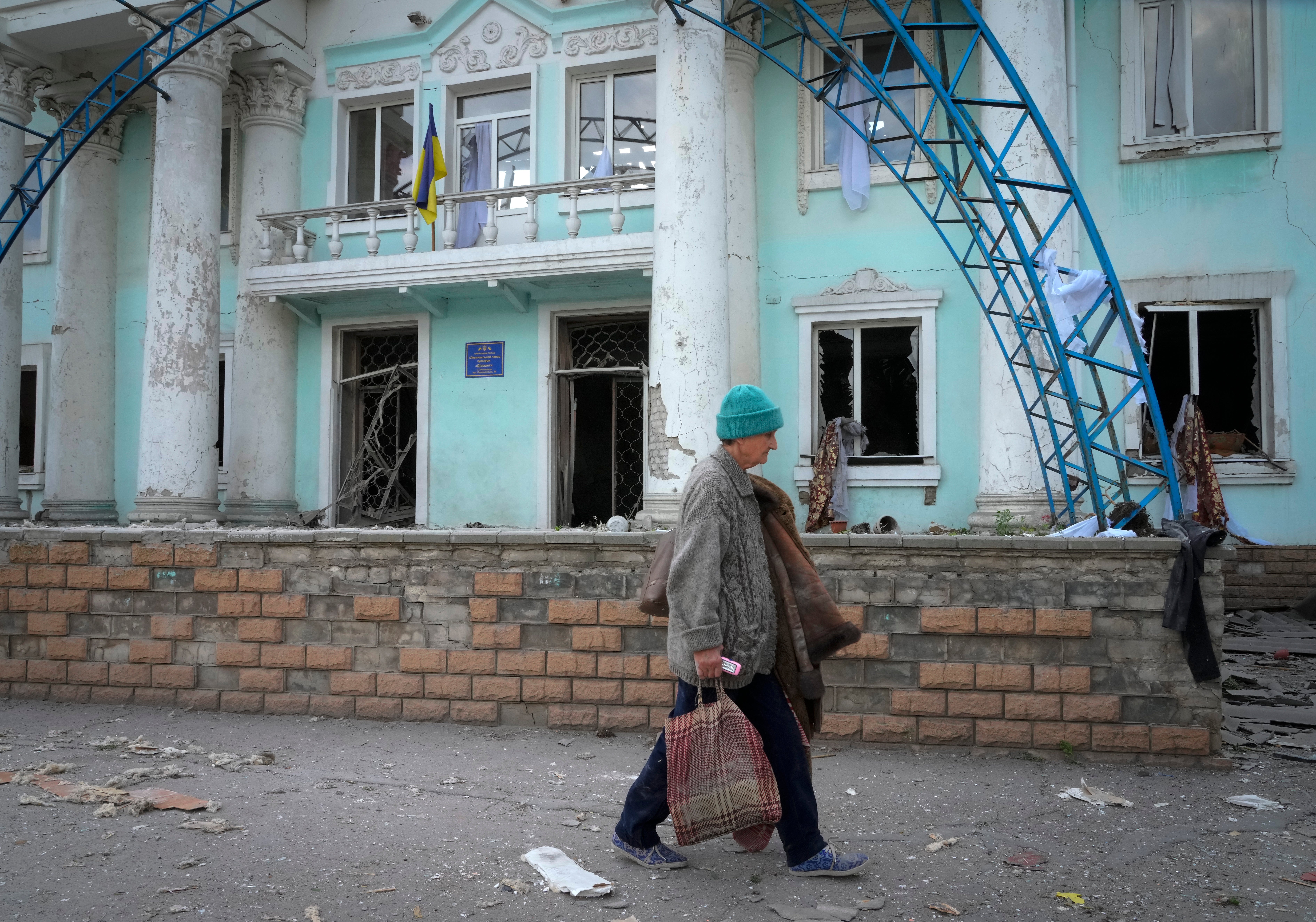 A woman passes by a building destroyed in the Russian shelling in Lysychansk, in the Luhansk region of Ukraine (Efrem Lukatsky/AP/PA)