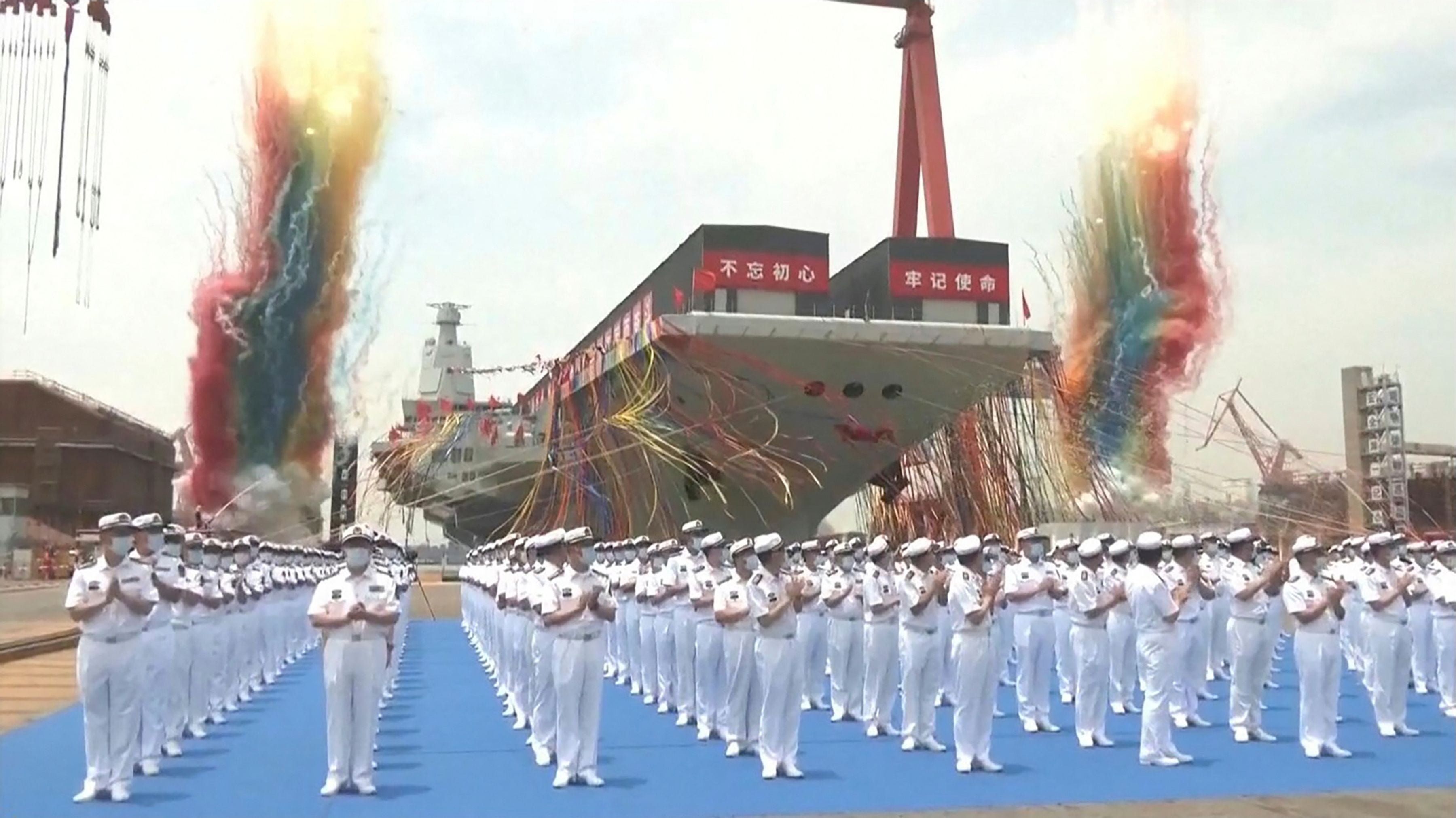 This screengrab made from video released by Chinese state broadcaster CCTV shows the launch ceremony of the Fujian, a People’s Liberation Army (PLA) aircraft carrier, at a shipyard in Shanghai on 17 June 2022