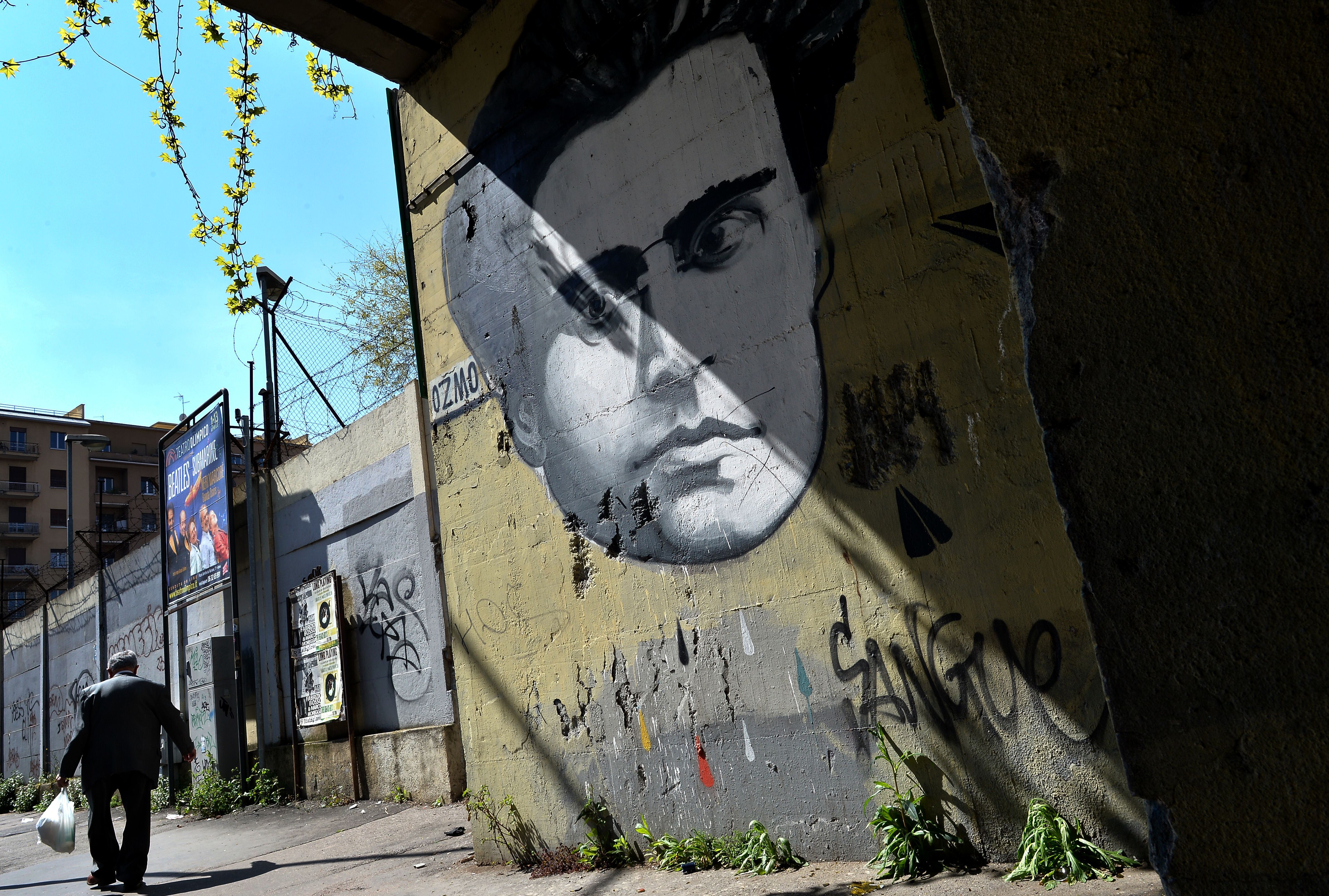 Graffiti of Antonio Gramsci covers a wall in Rome