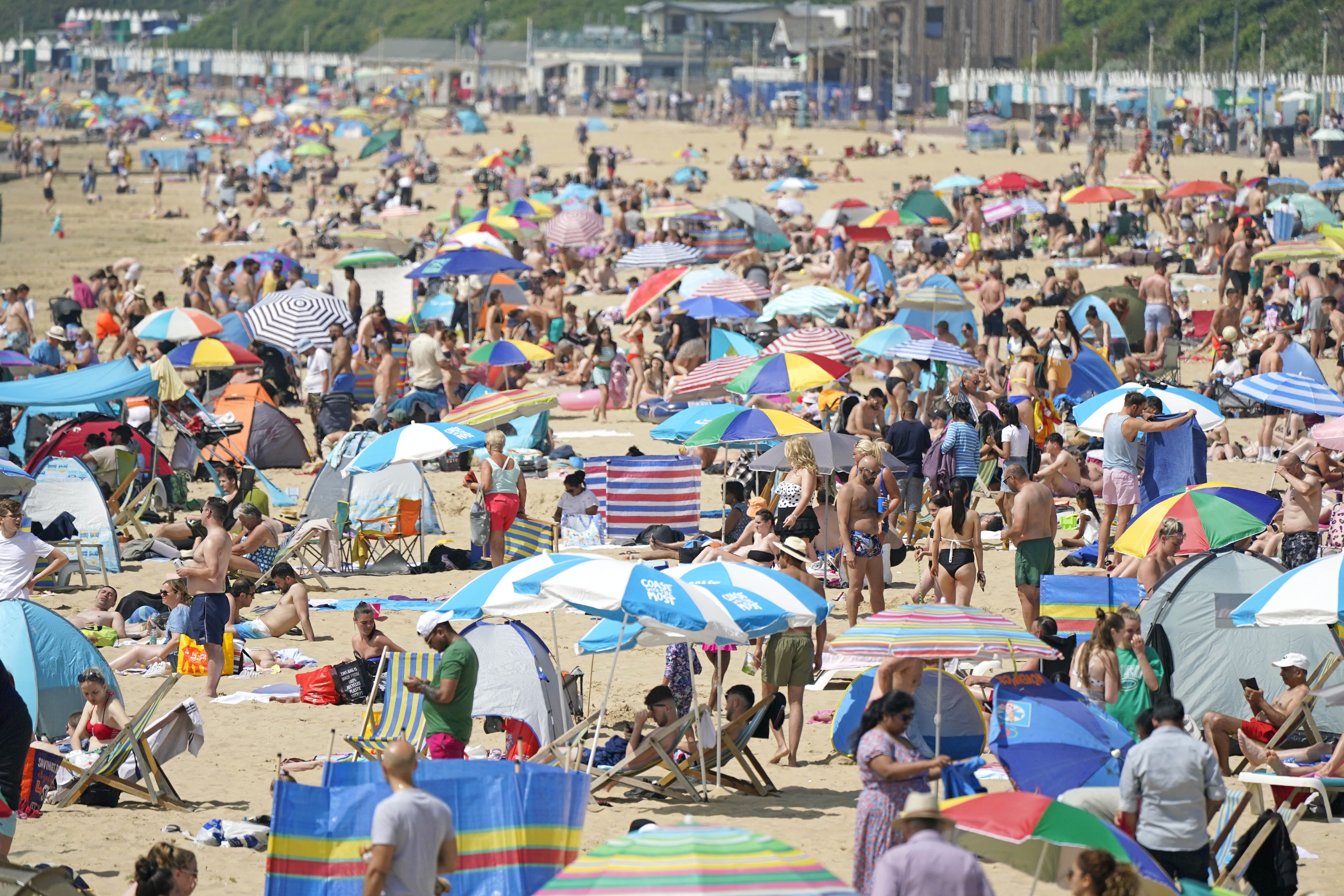 People relax in the hot weather on Bournemouth beach in Dorset