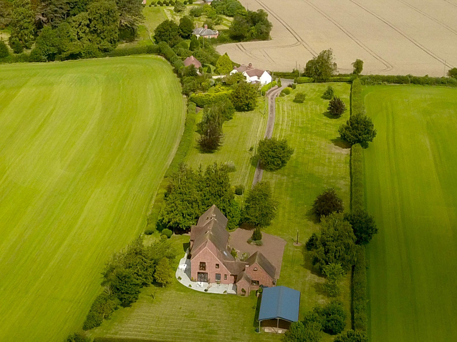 Aerial view of Quaking House Farm, in the foreground, near Kempsey in Worcestershire, where police discovered human bones in a cesspit