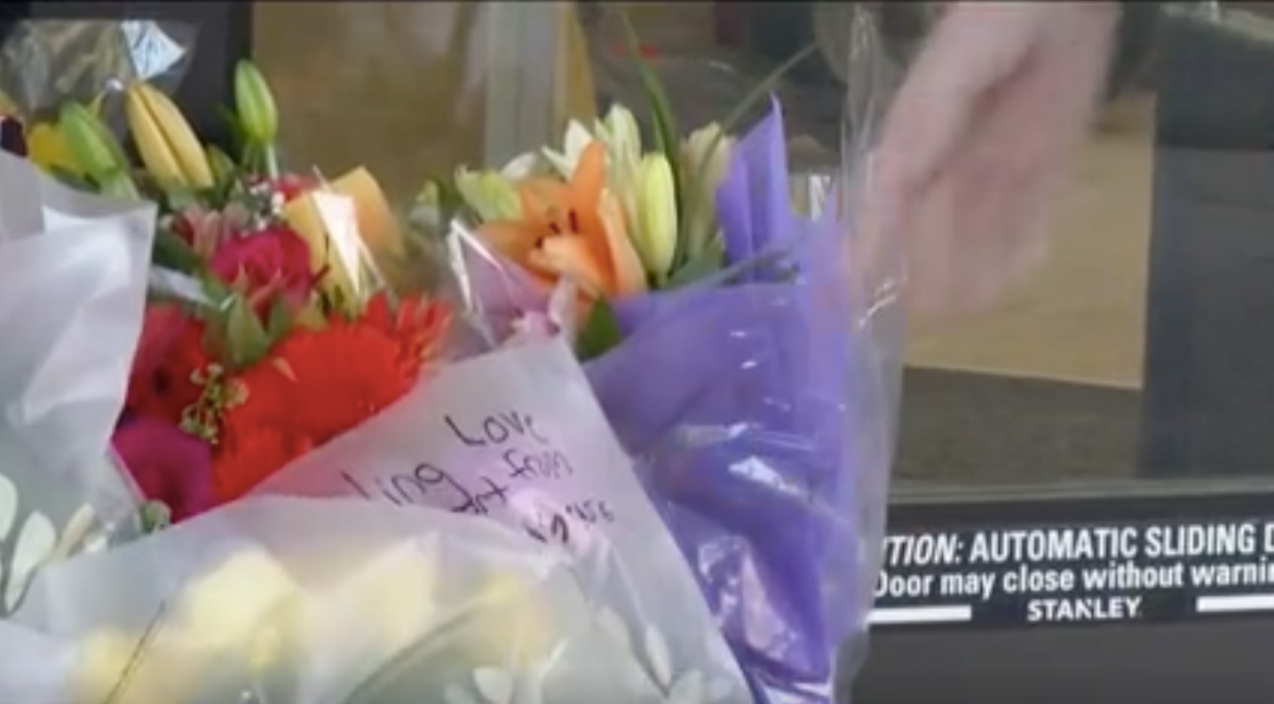 A makeshift memorial for 17-year-old Riley Whitelaw is seen outside the temporarily closed Walgreens in Colorado Springs where she was found dead last weekend