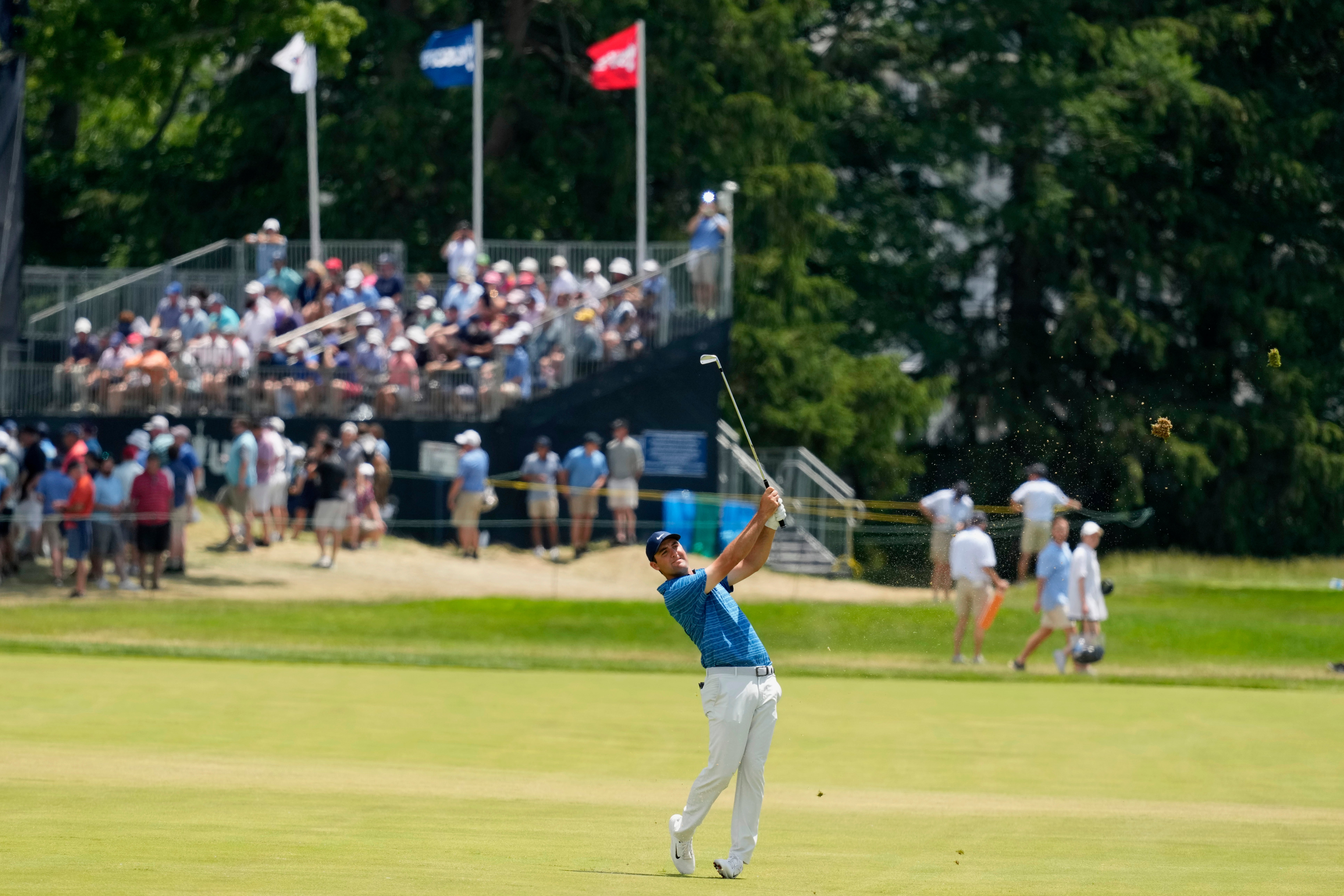 Scottie Scheffler watches his shot on the 18th hole during the second round of the US Open (Charlie Riedel/AP)
