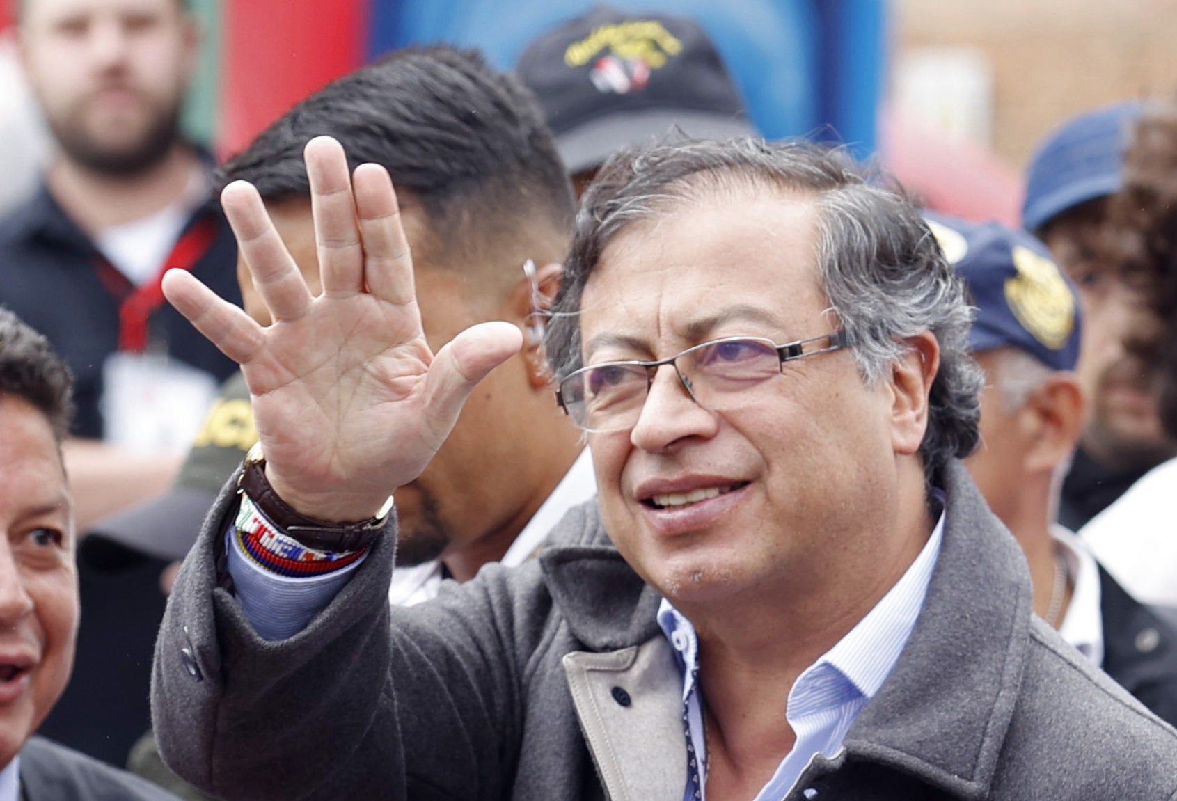 Gustavo Petro waves at a polling station in Bogota