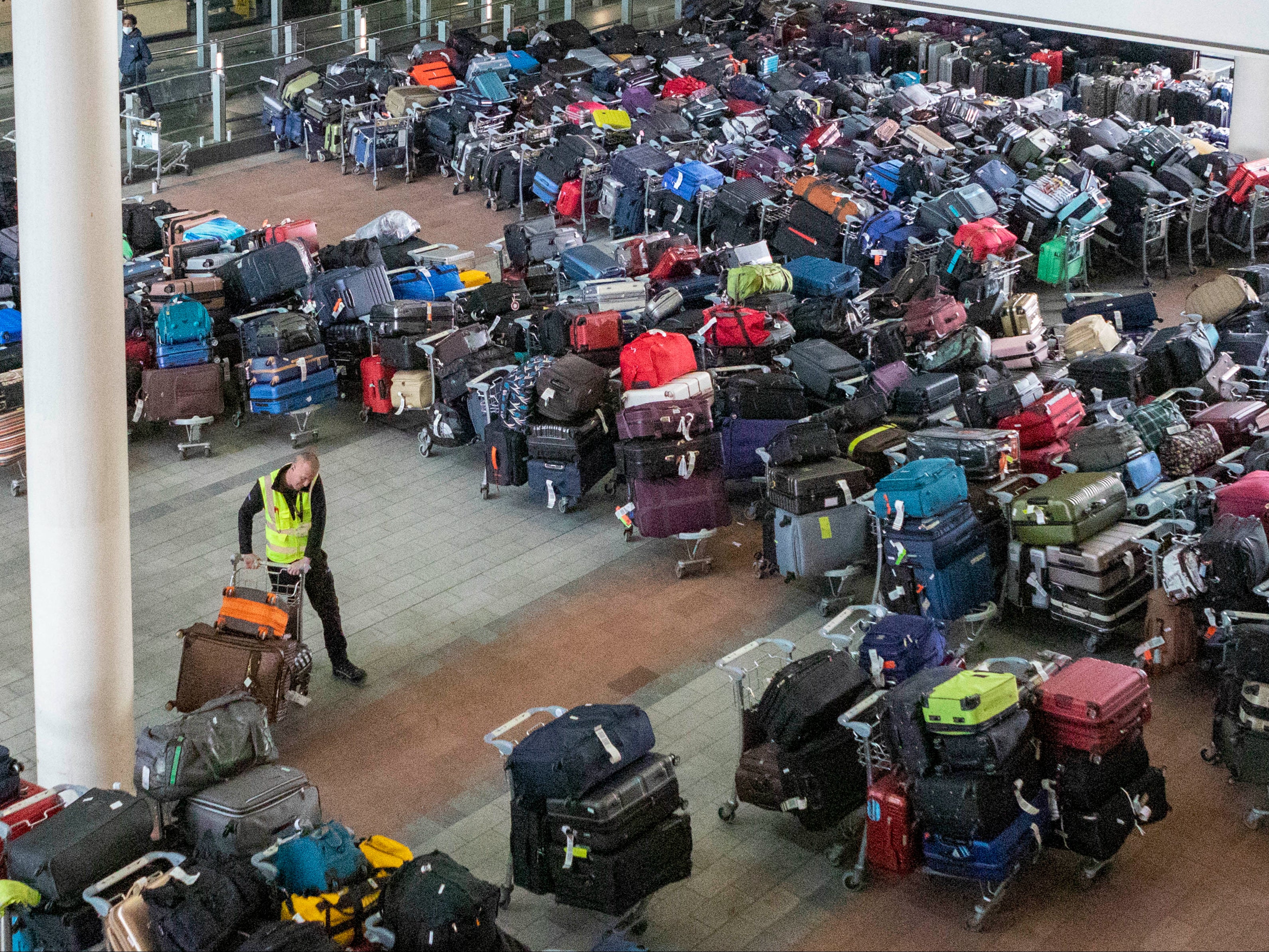 Heaps of luggage piled up pending collection at London Heathrow airport