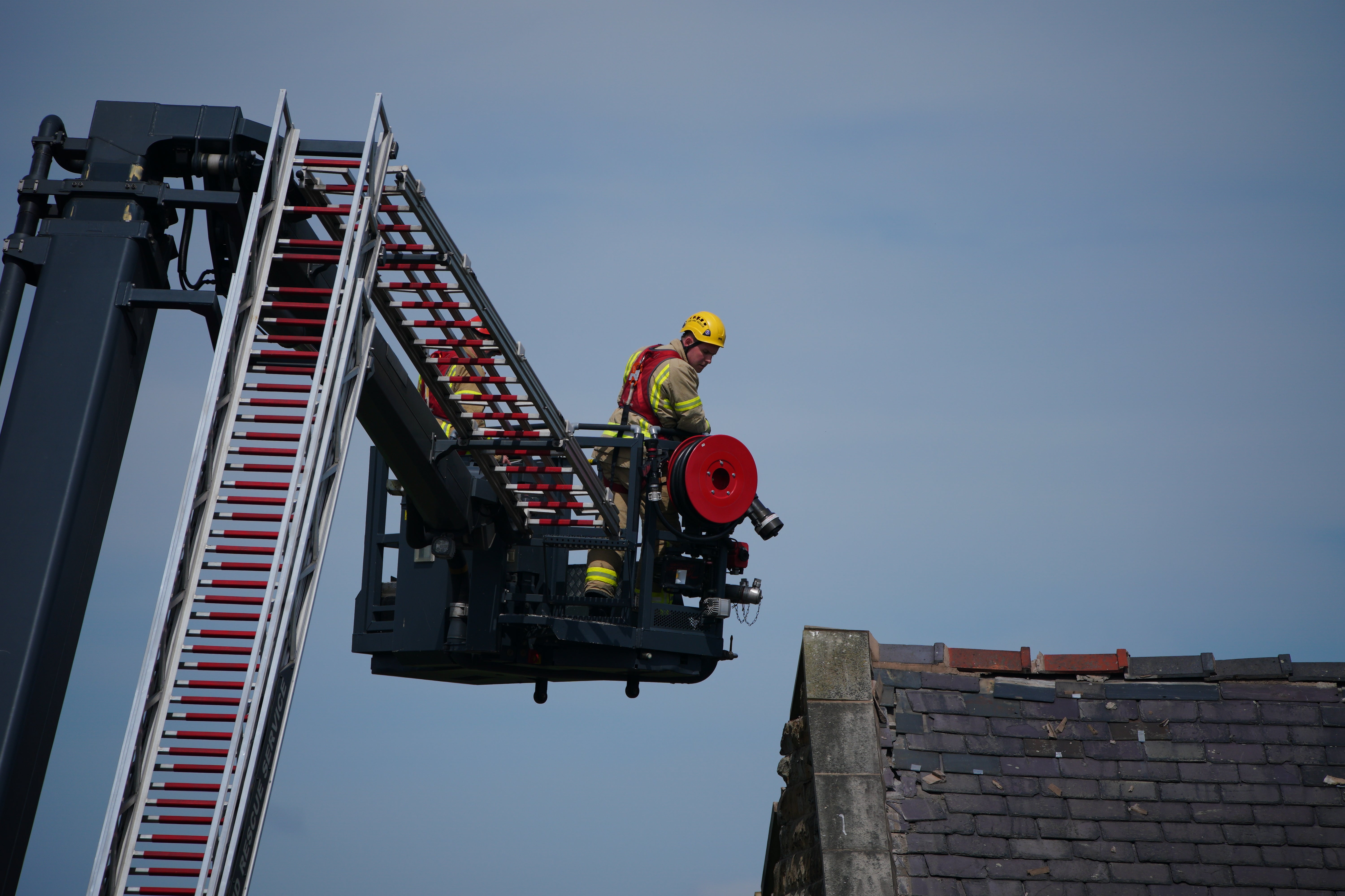 Emergency services work to stabilise the house