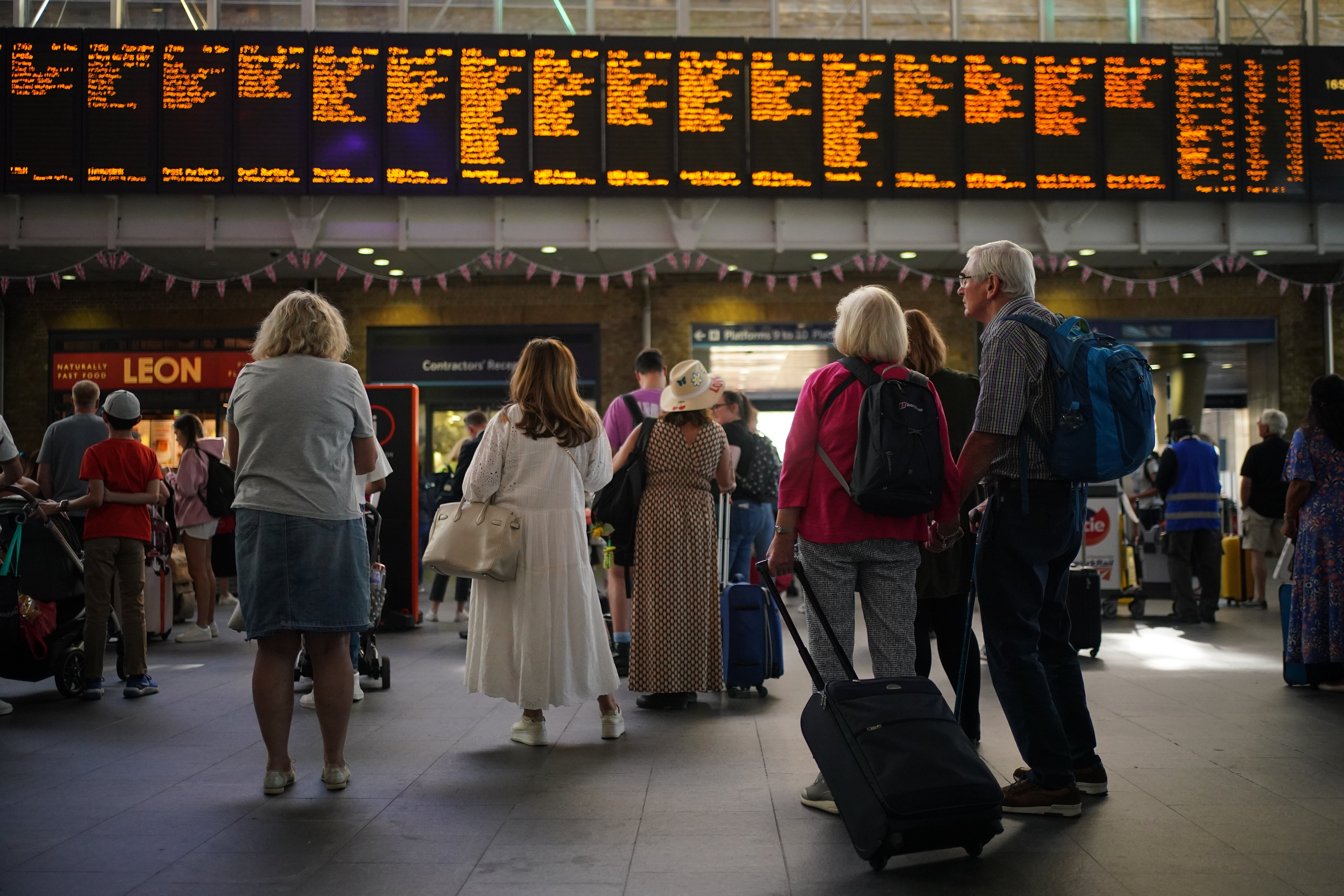 Passengers at London King’s Cross (Yui Mok/PA)