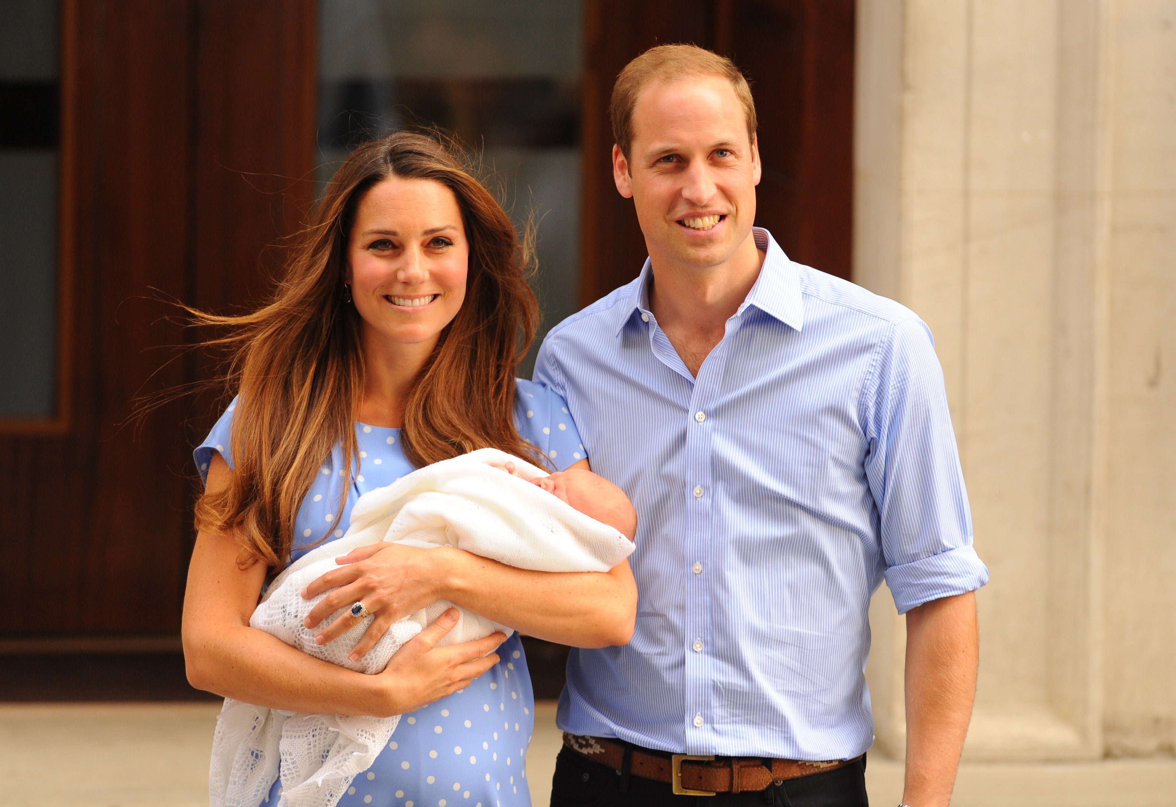 The Duke and Duchess of Cambridge leave the Lindo Wing of St Mary’s Hospital in London, with their newborn son, Prince George in 2013 (Dominic Lipinski/PA)