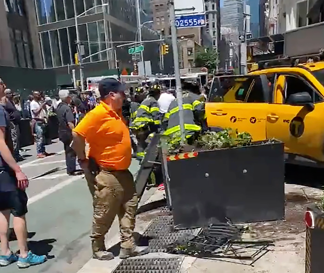 A taxi mounted the curb on Broadway in Manhattan’s Flat Iron district on Monday, leaving three seriously injured