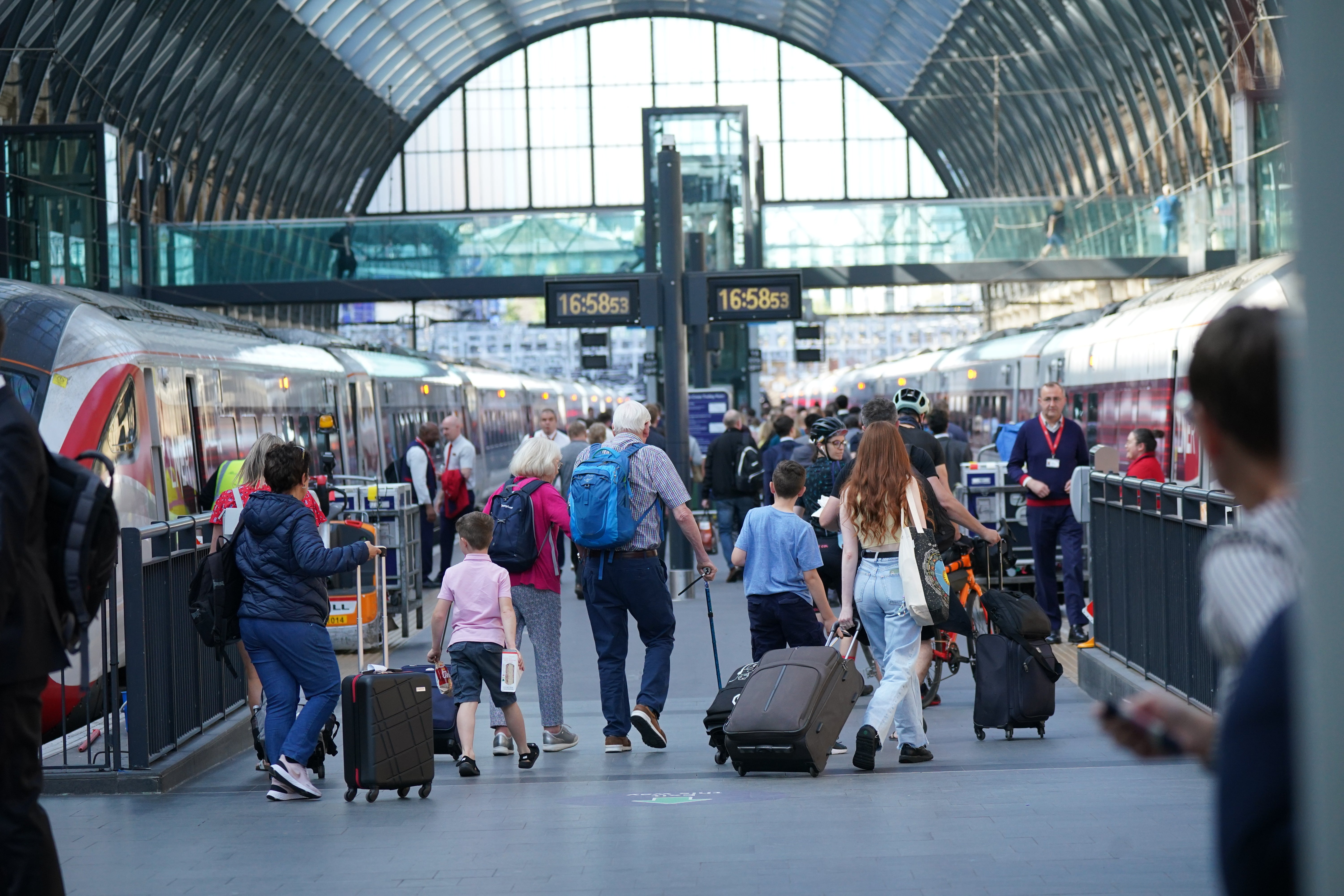 Passengers at London King’s Cross station (Yui Mok/PA)