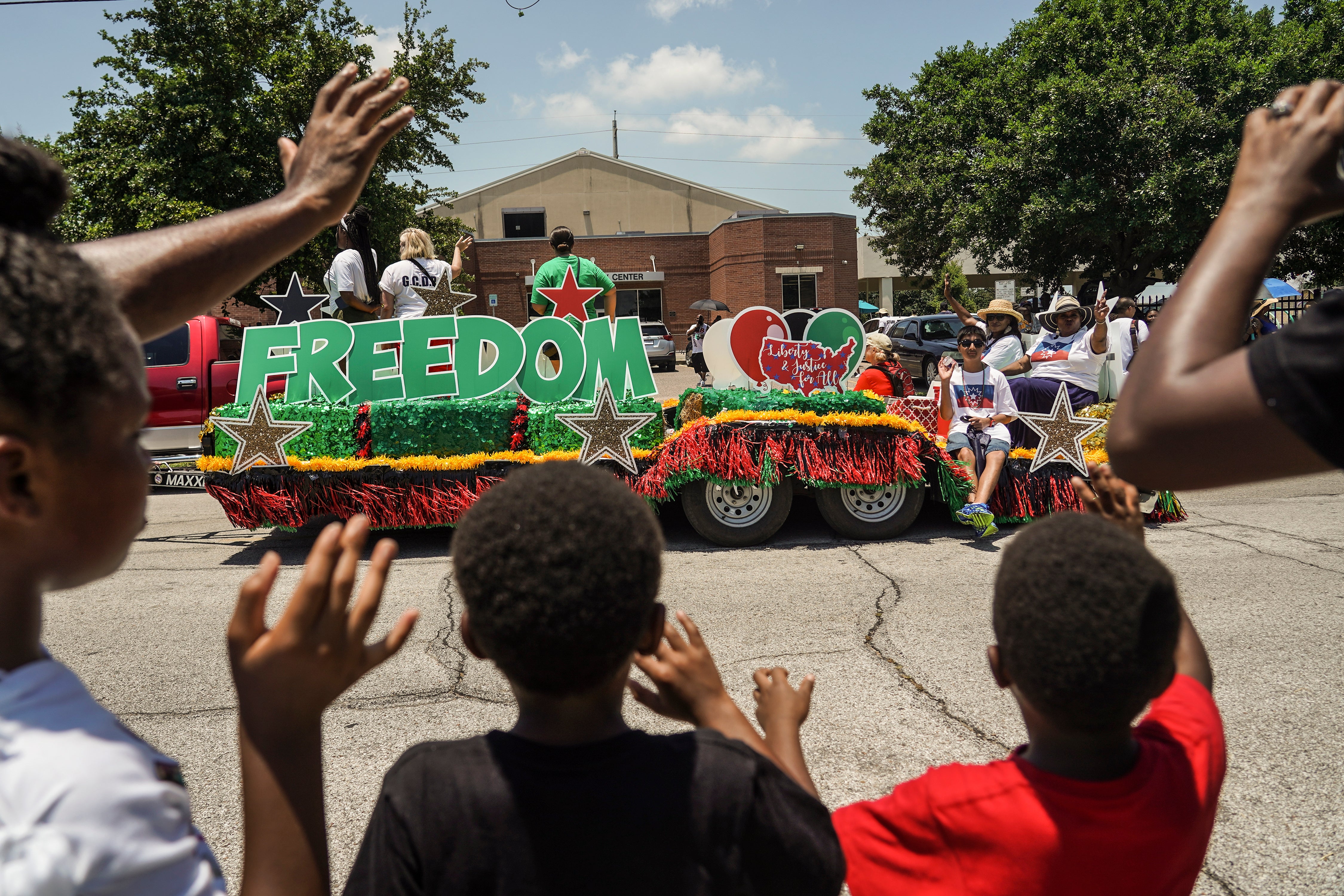 Spectators watch a Juneteenth parade commemorating the end of slavery in the United States in Galveston, Texas last year