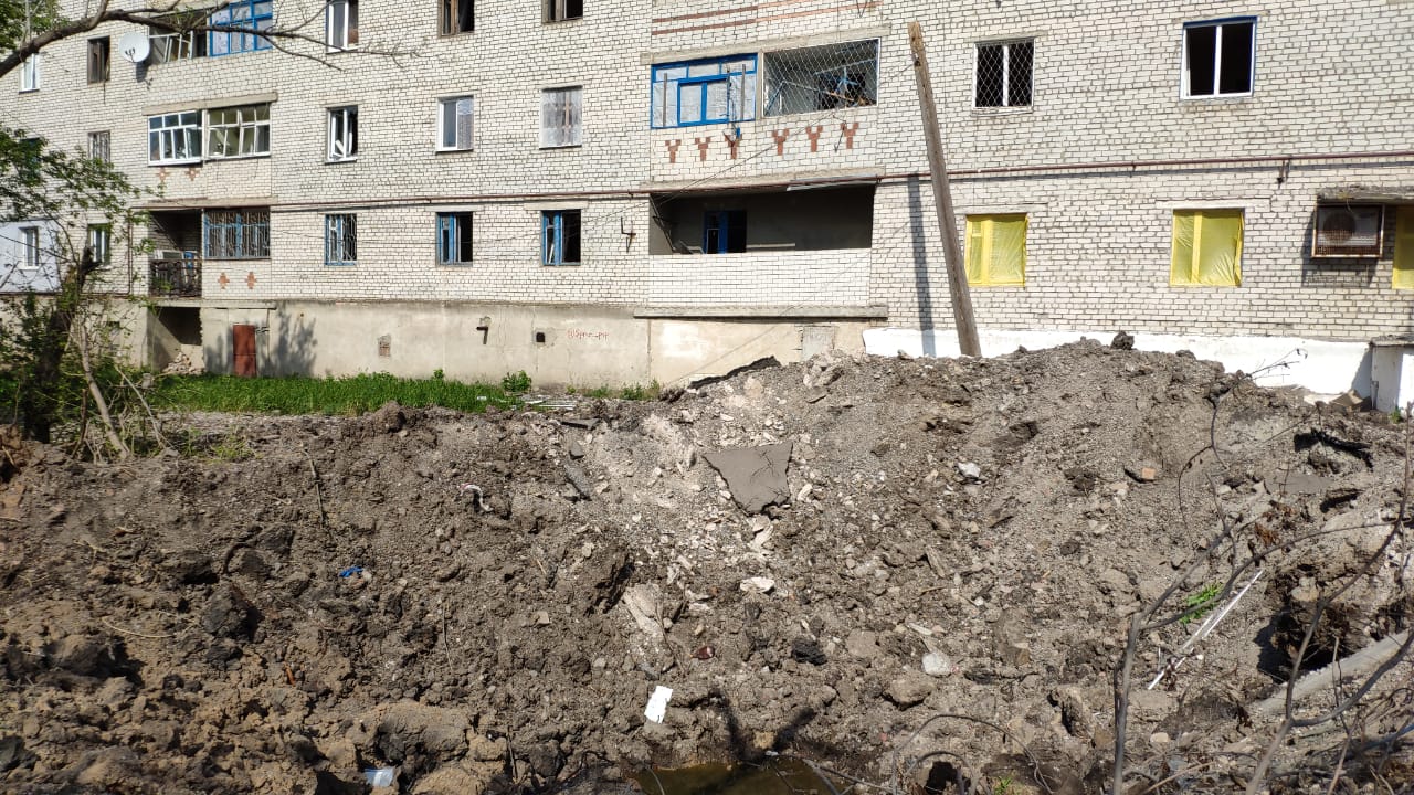 A huge Russian bomb crater close to a residential block in Siversk, eastern Ukraine