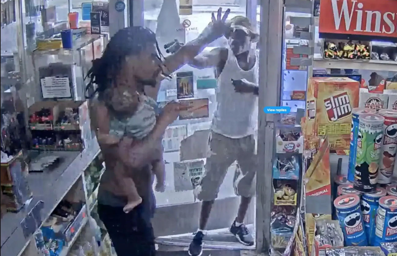 A Detroit father is seen fighting off a gas station gunman while he held his baby with one arm on Father’s Day