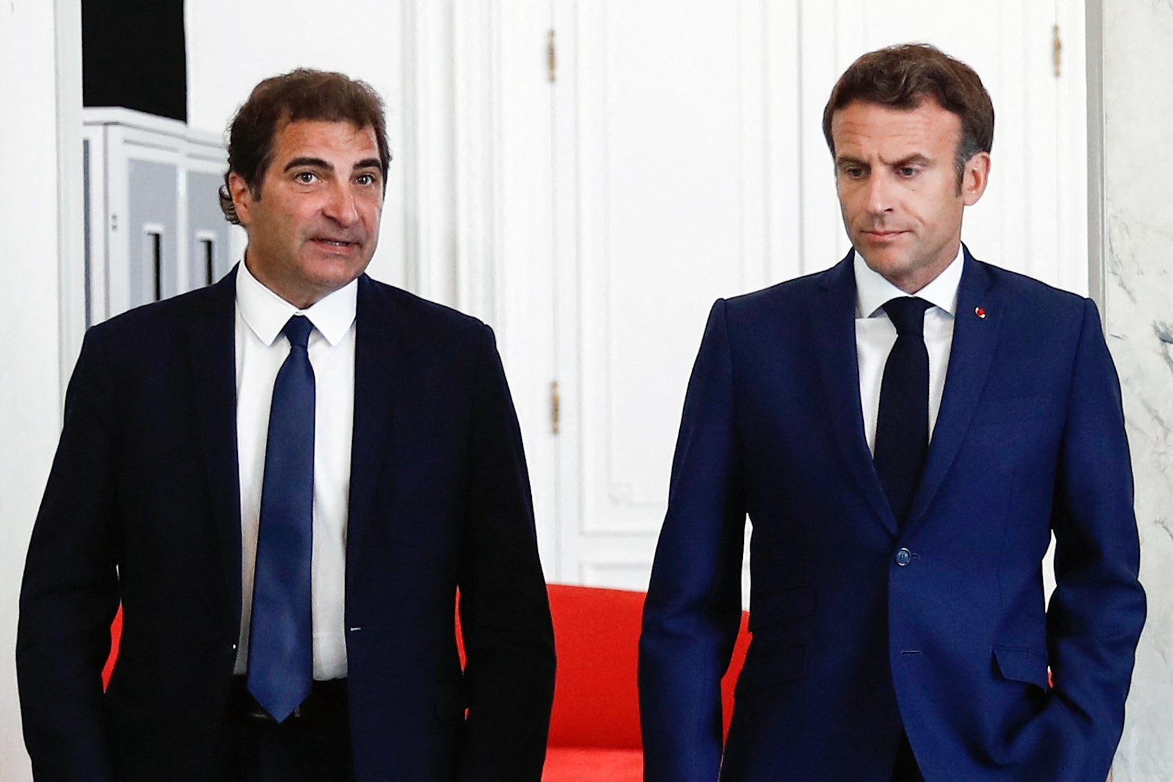 French president Emmanuel Macron (R) walks next to France’s right-wing Les Republicains (LR) party president Christian Jacob in Paris